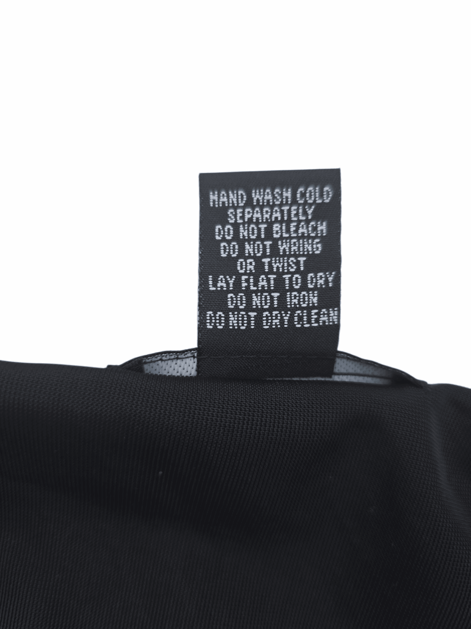 Garment care tag for Elementz black crushed velvet rhinestone pullover top showing washing and drying directions.