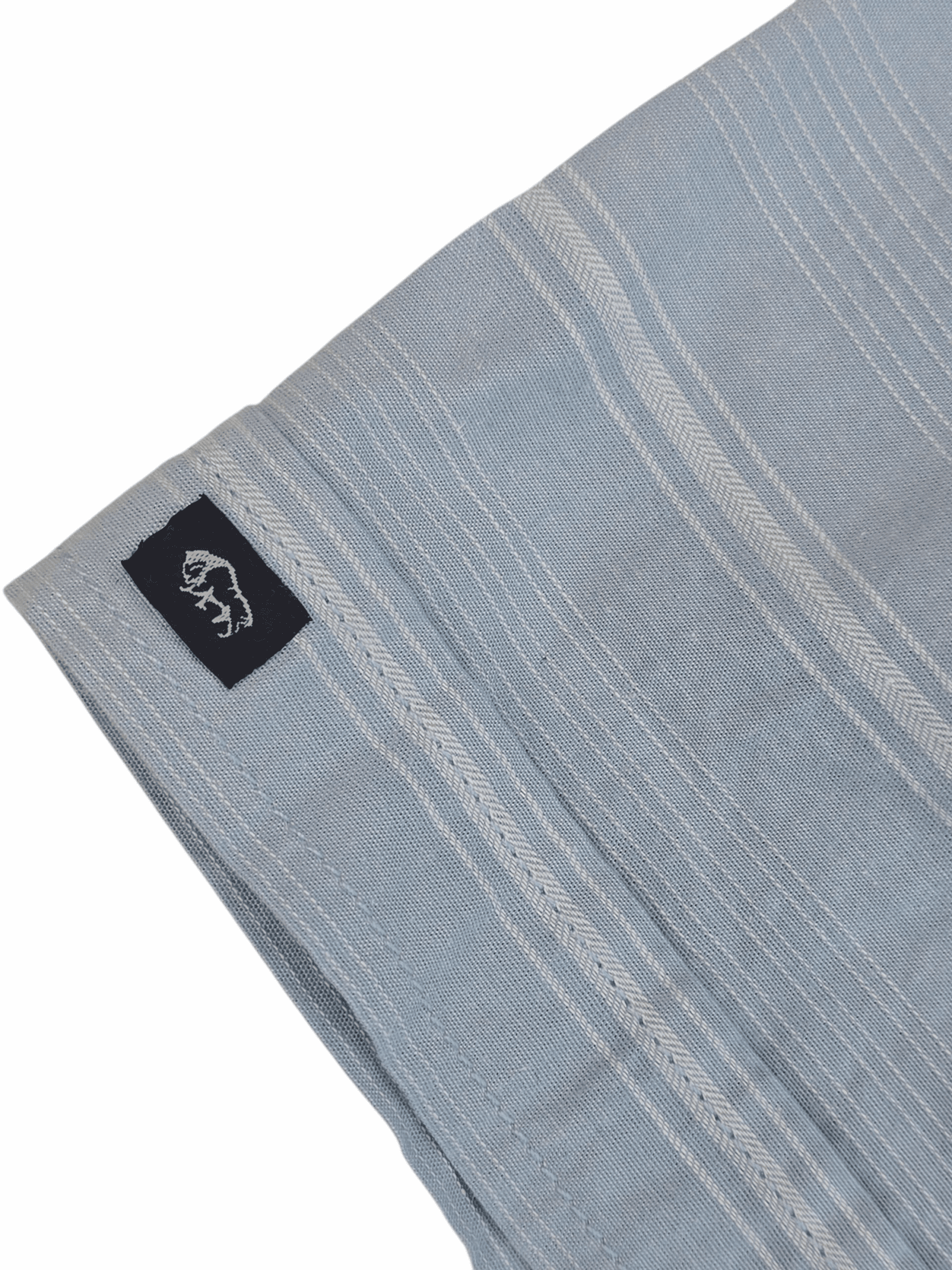 Light blue fabric with subtle white stripes and a black tag.