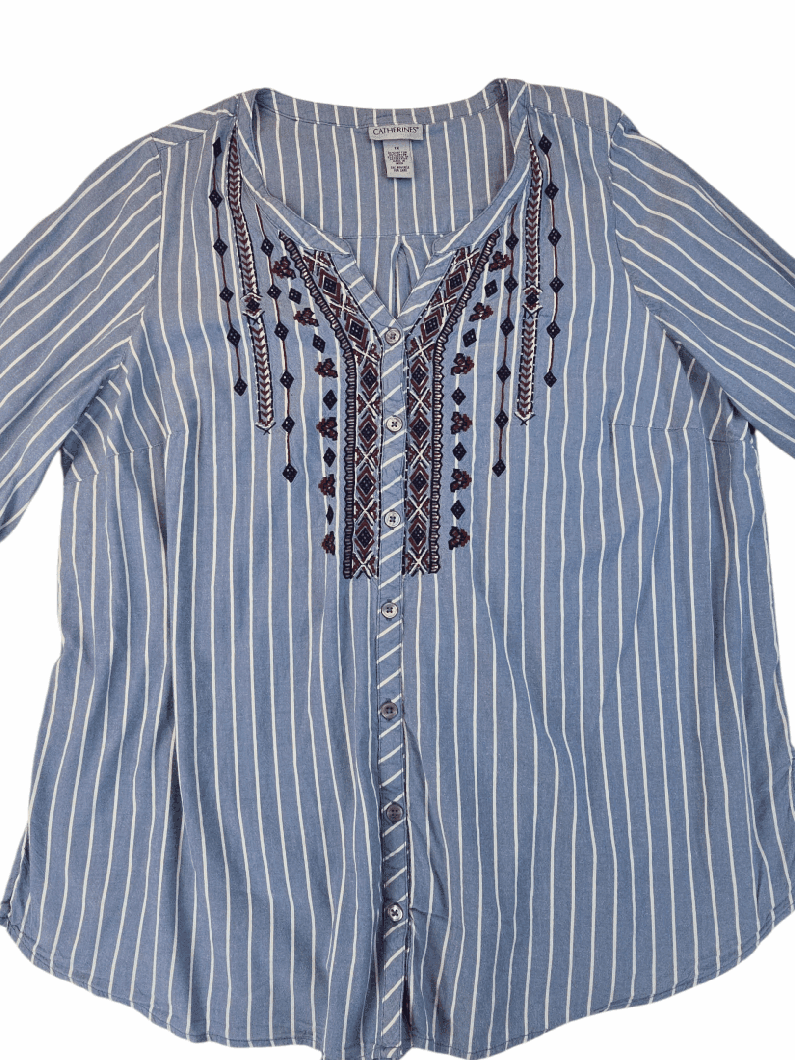 Striped blouse with intricate embroidery on the front.