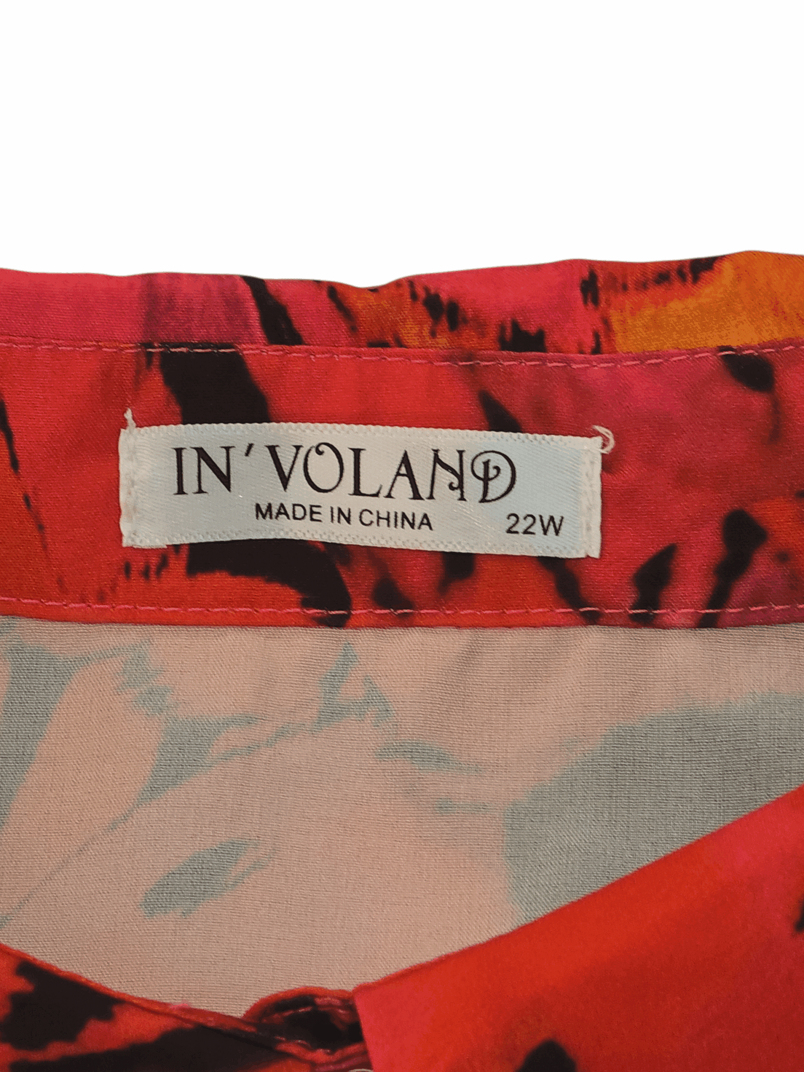 Clothing label showing brand and size details.