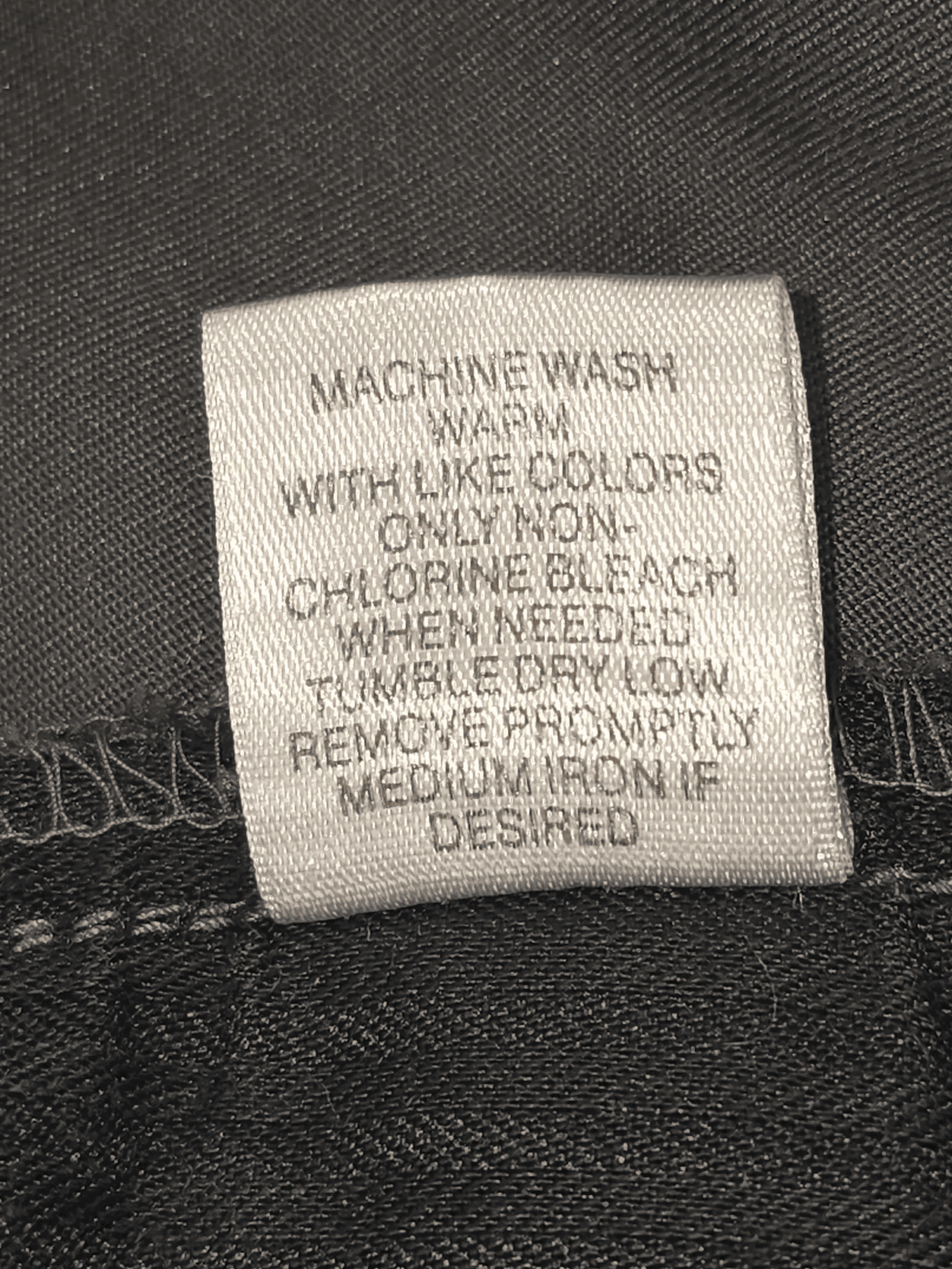 Garment care instruction tag from Roundtree & Yorke expandable easy care gray shorts men’s size 48