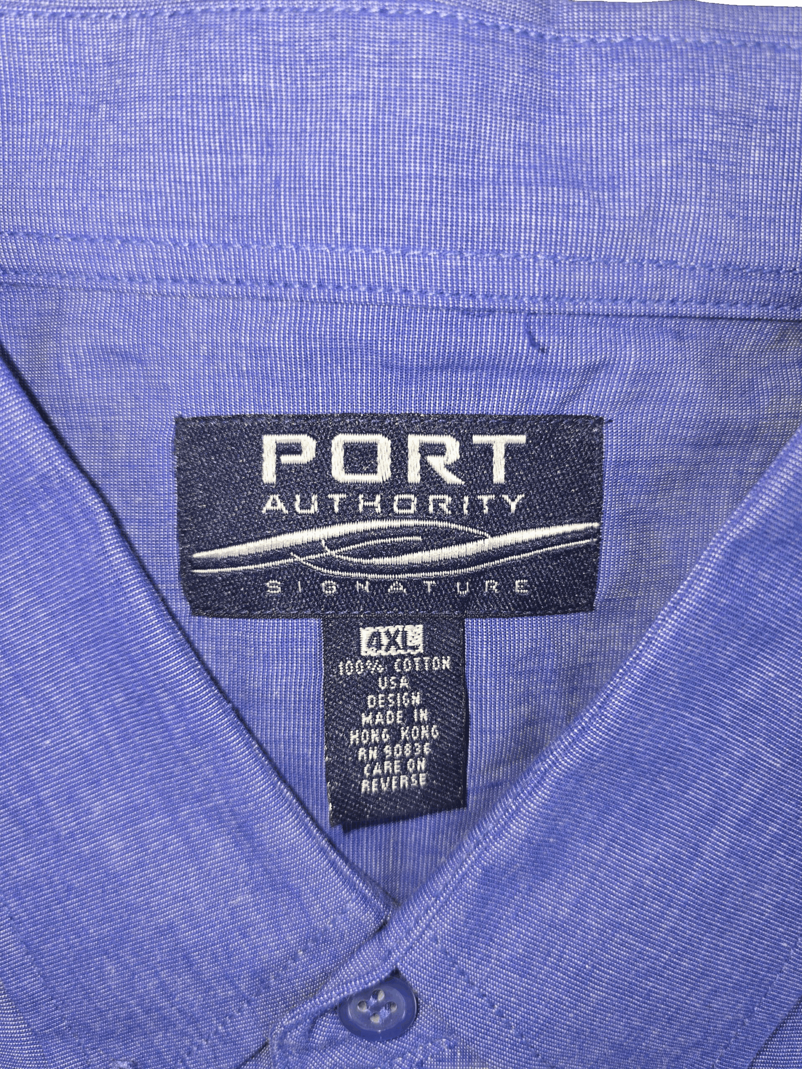 Close-up of a blue Port Authority shirt label.