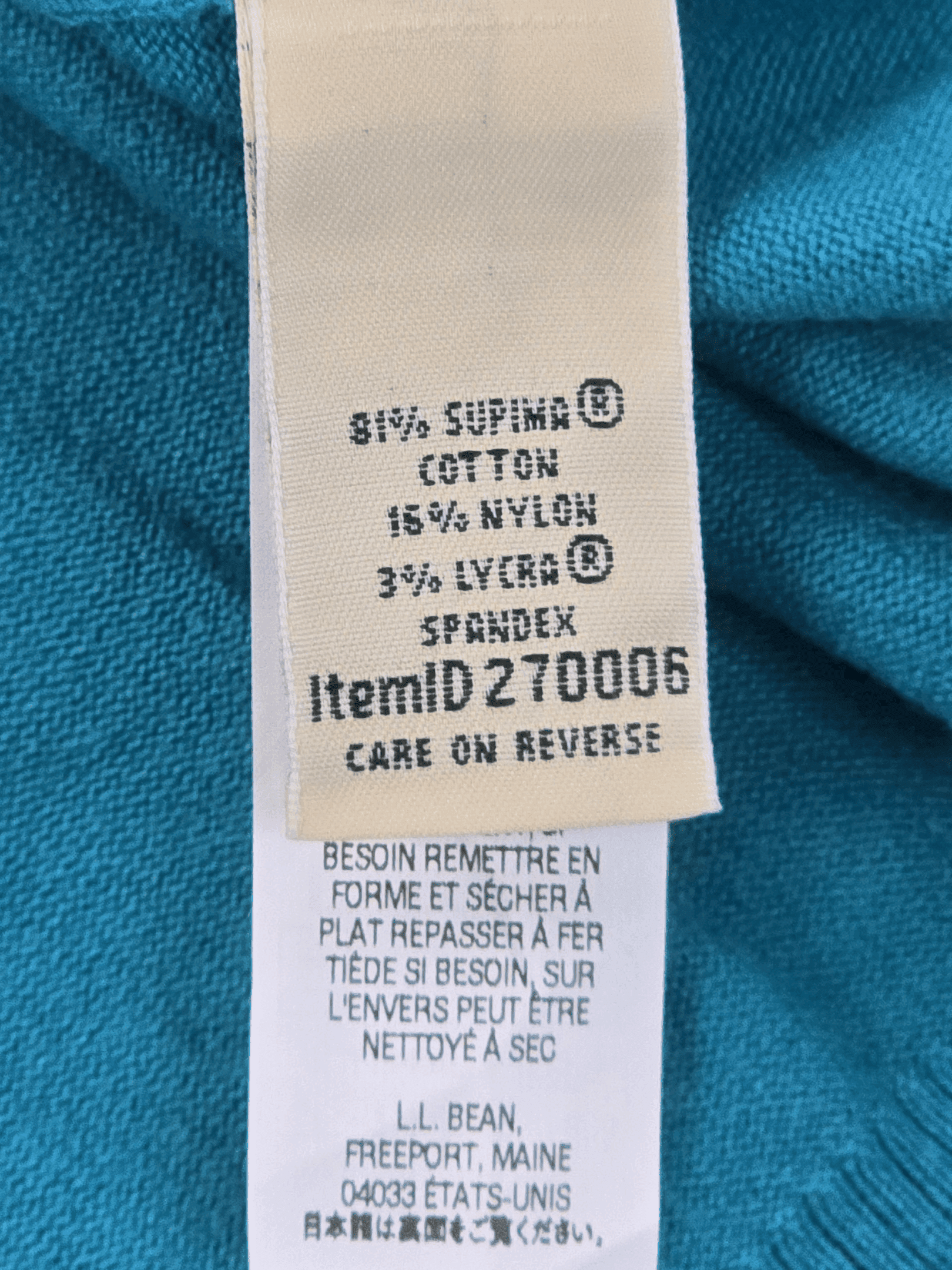 Fabric content tag from L.L. Bean blue button-up cardigan sweater women’s plus size 3X