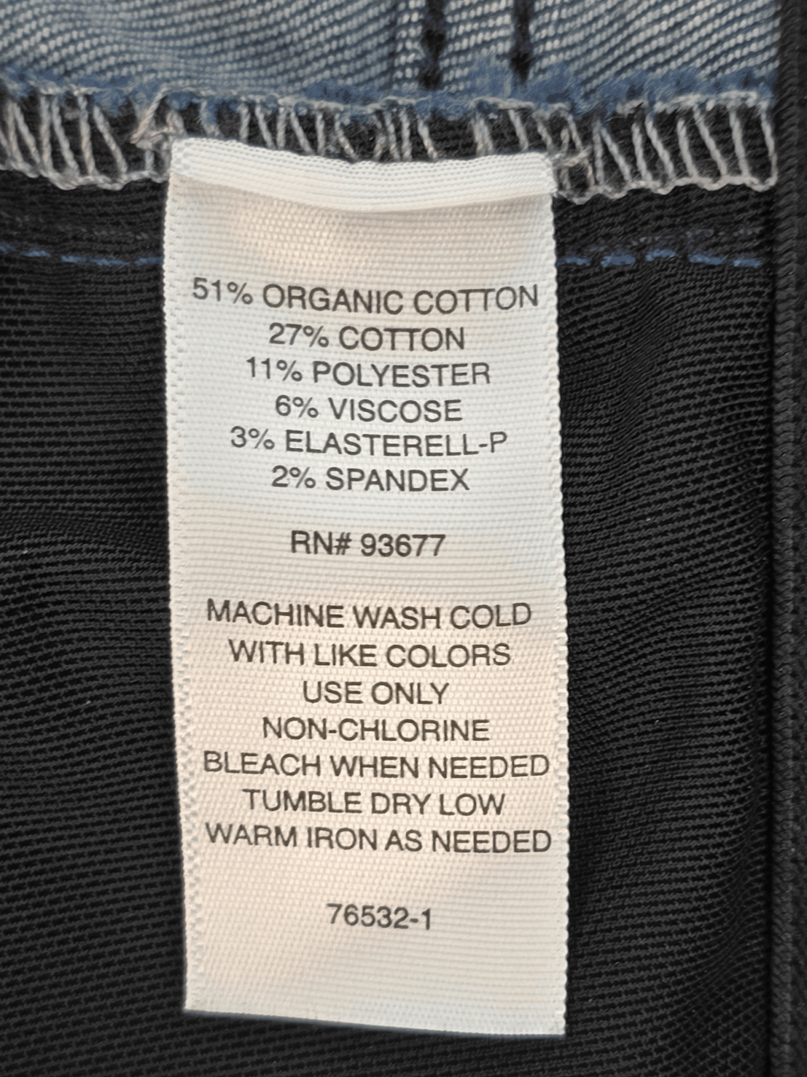 Close-up of material content and garment care tag on Liz Claiborne Sara women’s plus size 16 blue cropped mid-rise jeans