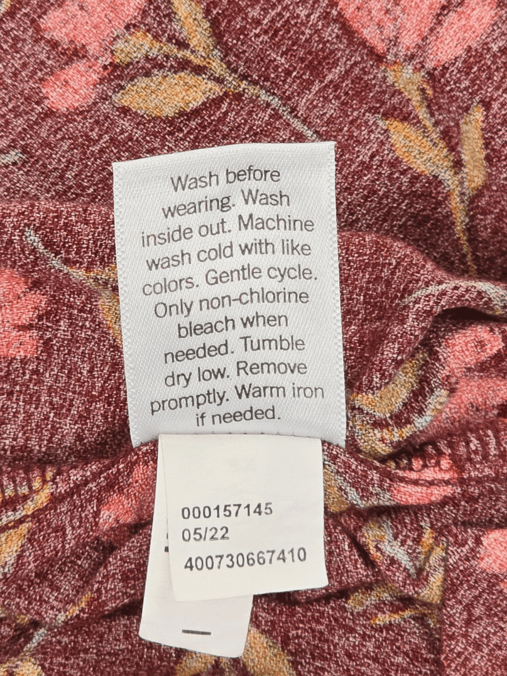 Garment care tag for Sonoma rust floral rayon pullover top showing washing and drying instructions.
