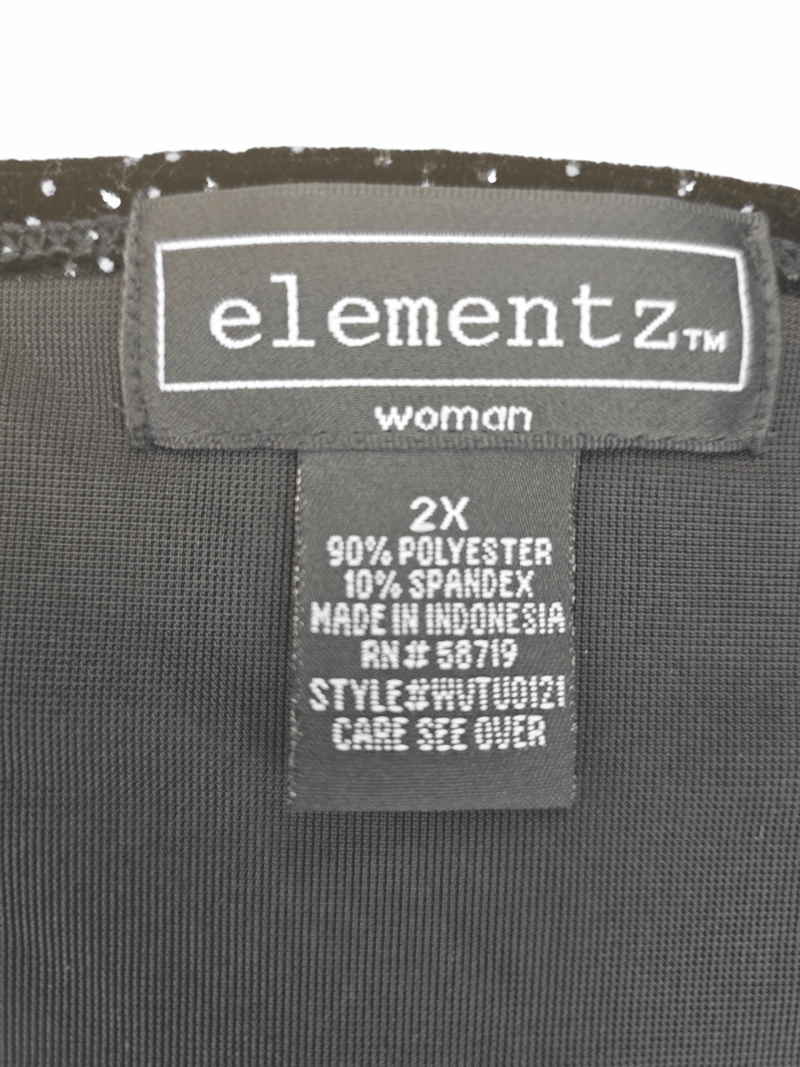 Elementz material content, brand and size tag on black crushed velvet rhinestone pullover top in women’s size 2X.
