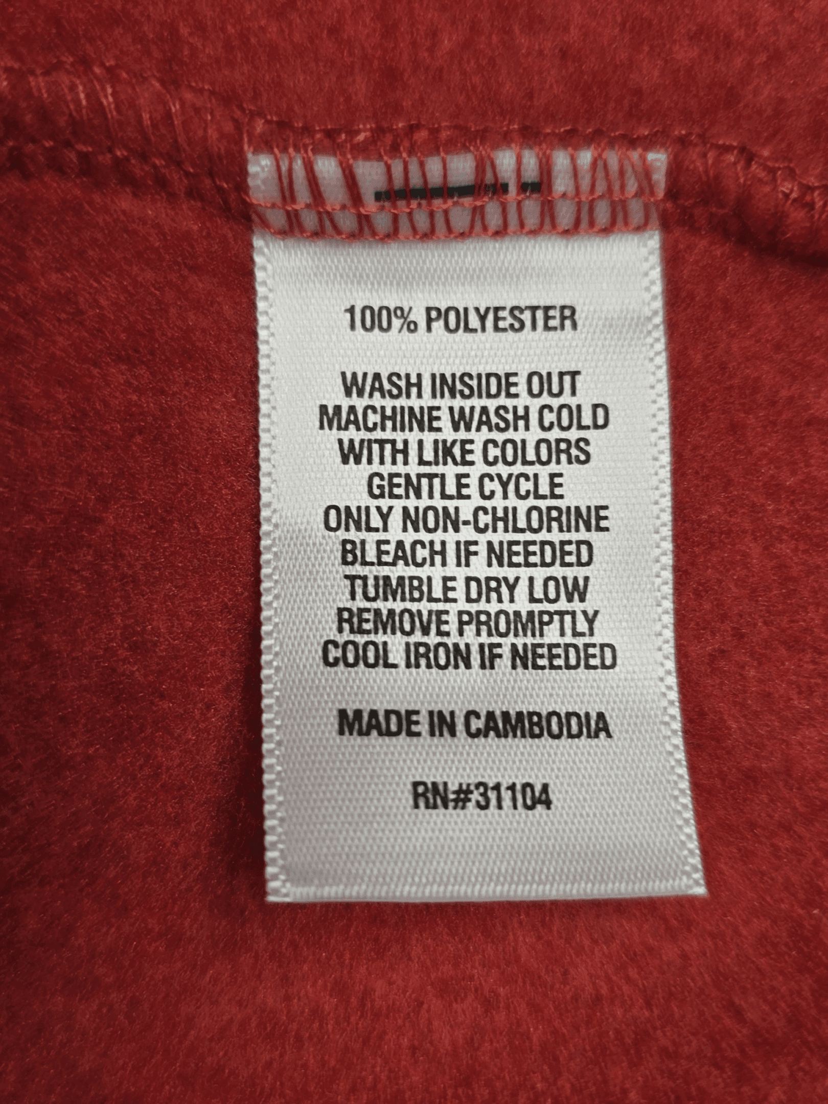 Material content tag listing fiber composition for Sonoma rust floral rayon pullover top.