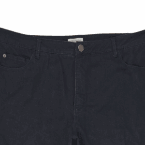 Close-up of Coldwater Creek black straight-leg jeans showing button, zipper, and front stitching detail.