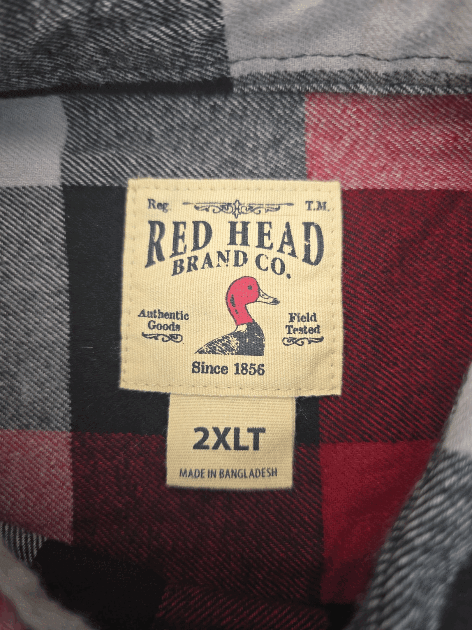 Red Head brand and size tag on red, black, and gray plaid flannel button-up shirt in men’s size 2XLT.