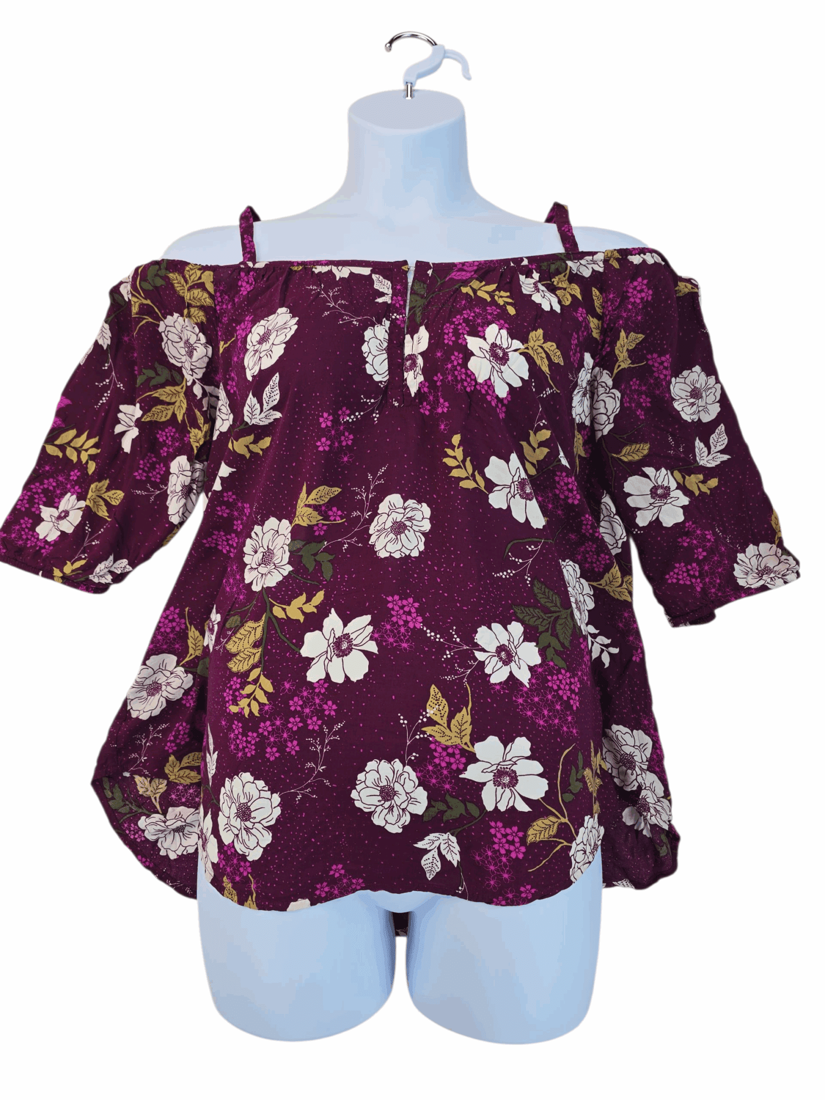 Purple floral off-shoulder blouse with half sleeves on a mannequin.