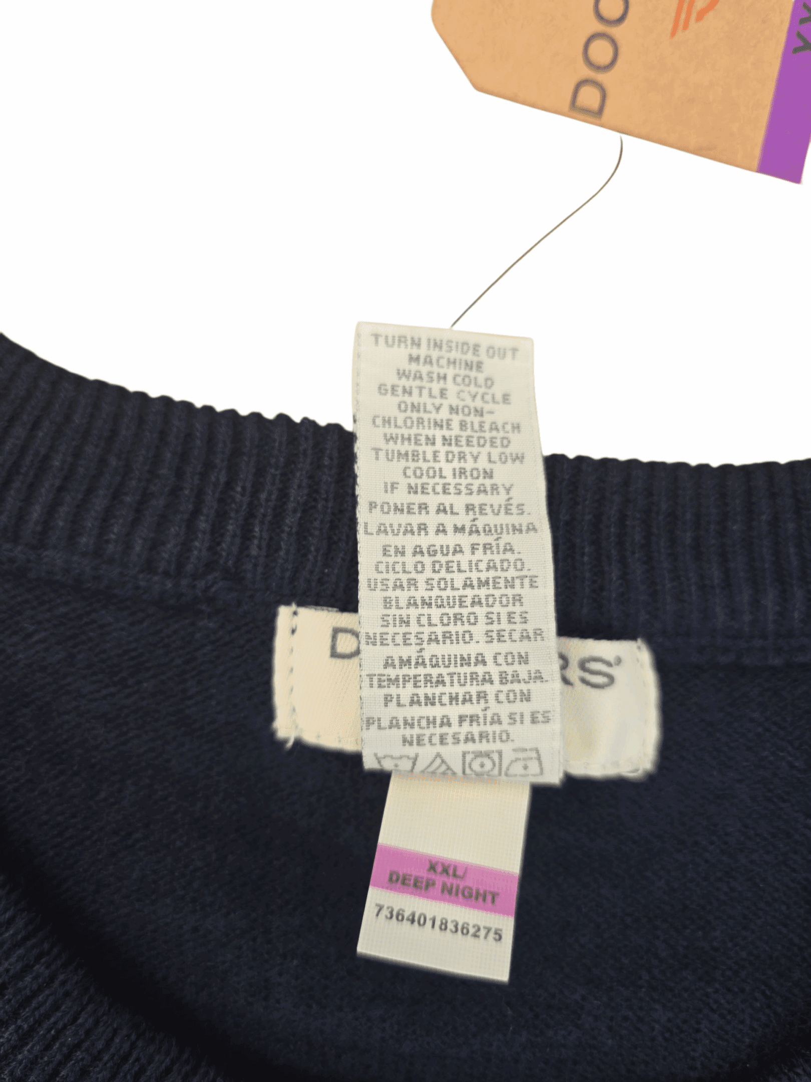 Garment care tag for Dockers navy argyle crew neck sweater showing washing and drying instructions.