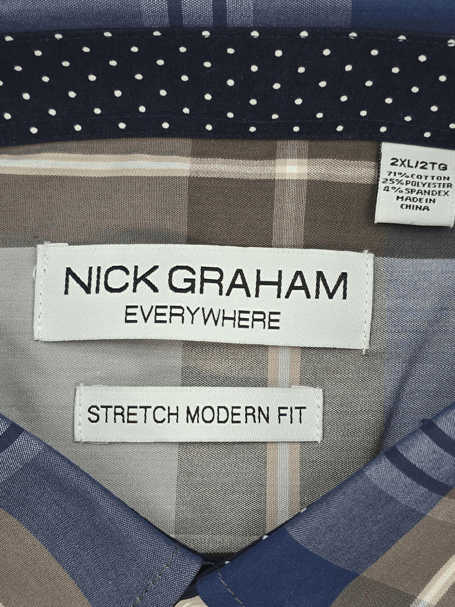 Nick Graham brand and size tag on “Everywhere Stretch” navy and brown plaid shirt in men’s size 2XL.