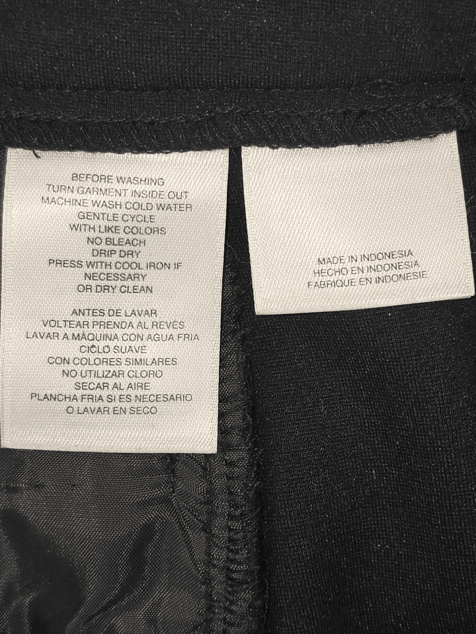 Garment care instruction tag from Anne Klein black knit stretch tapered leg slacks women’s size 14