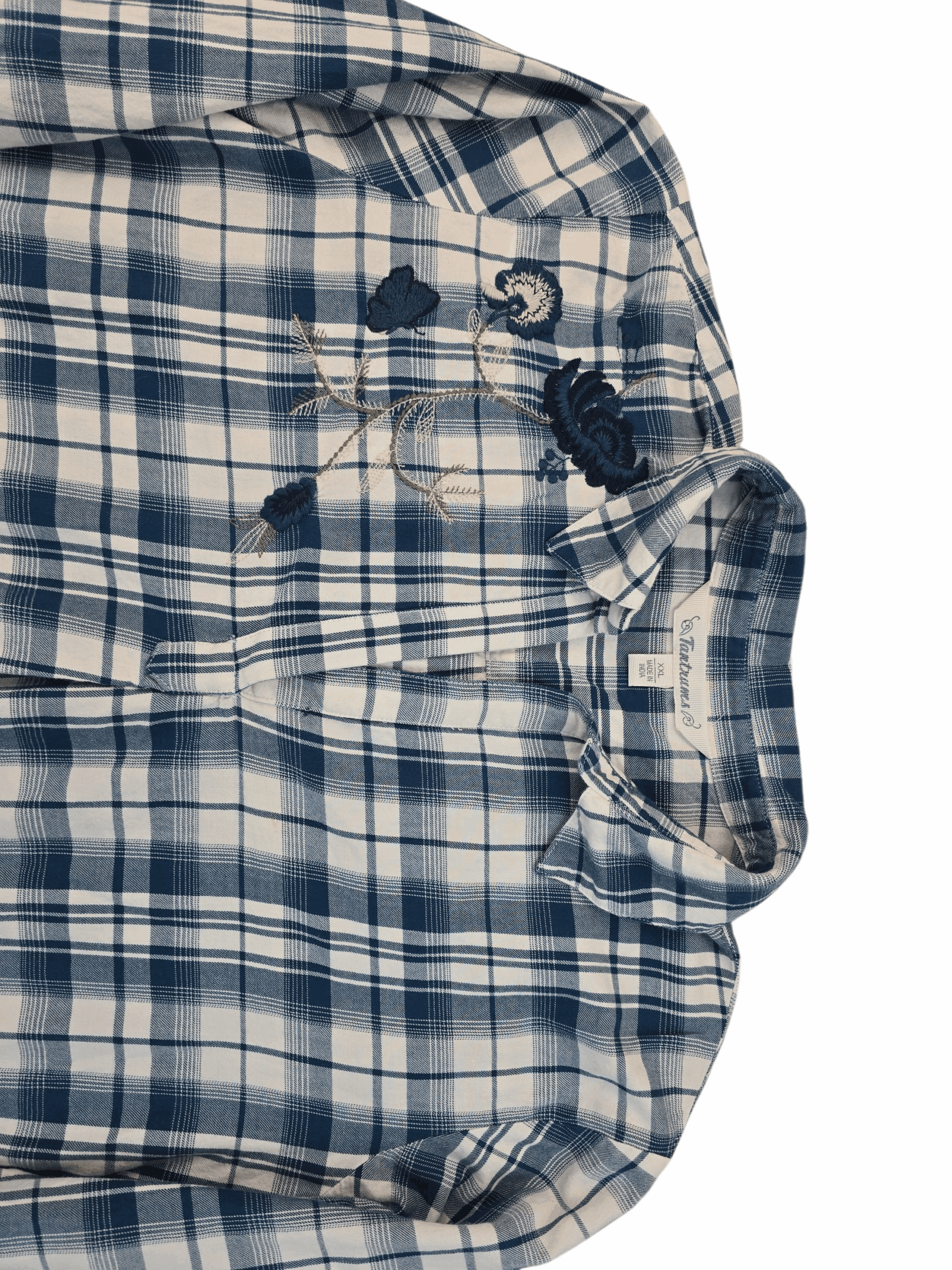 Folded blue and white plaid shirt with buttons.