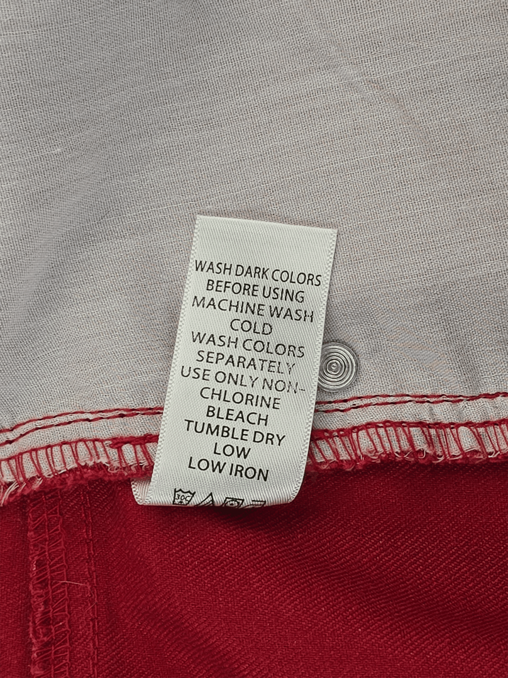 Woman Within red straight-leg denim jeans care instructions label