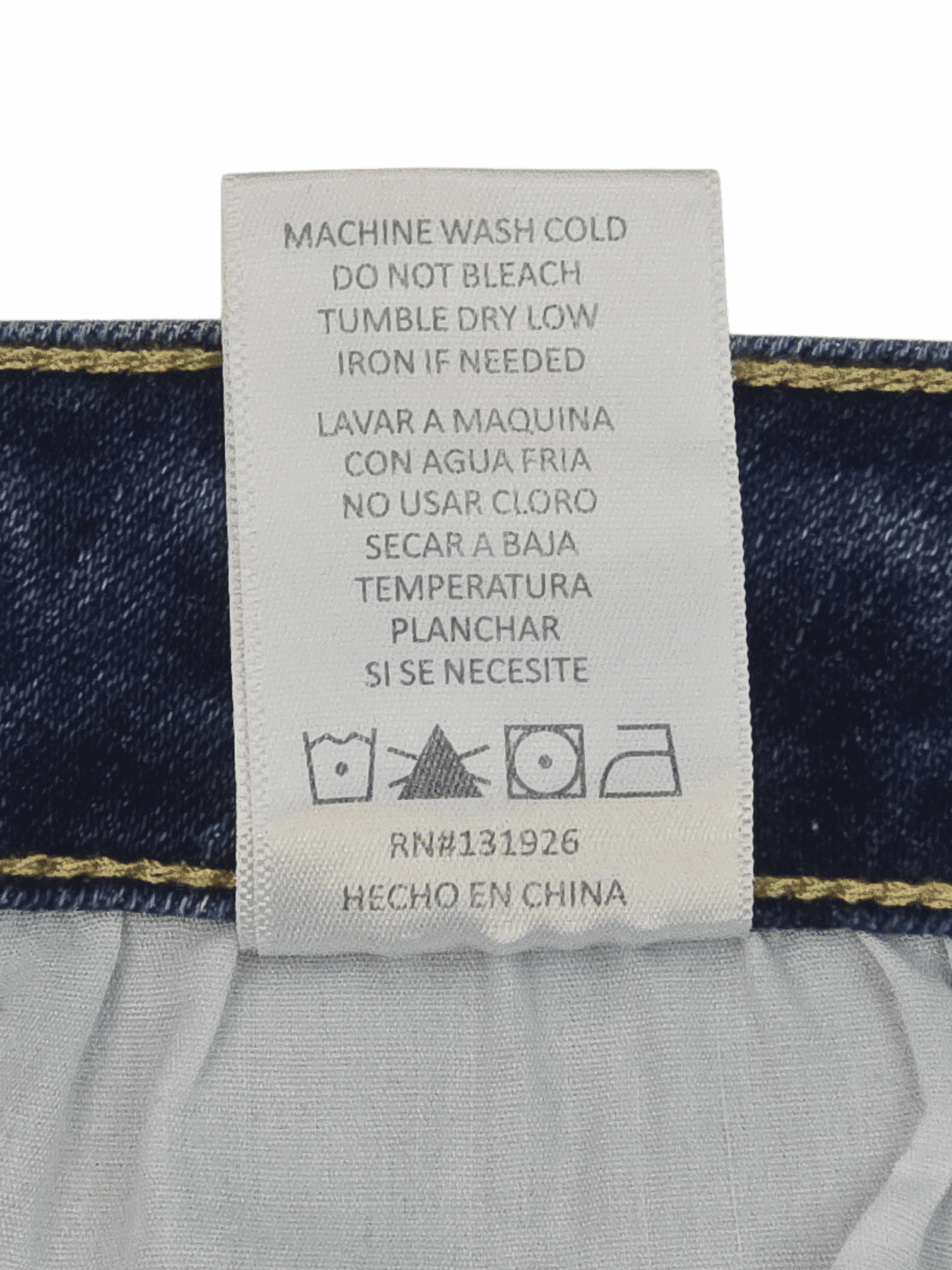 Garment care instruction tag from TNR blue distressed tapered jeans women’s plus size 20