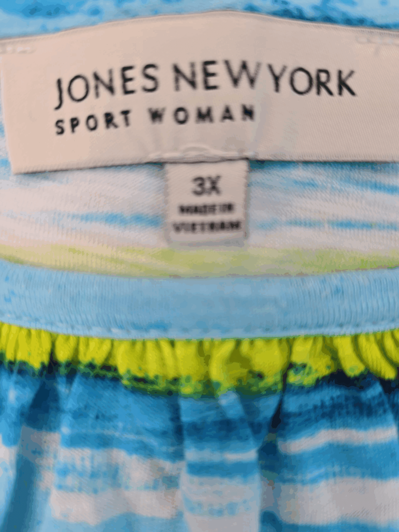 Jones New York Sport Woman brand and size tag on blue and yellow paint stroke pullover top in women’s size 3X.