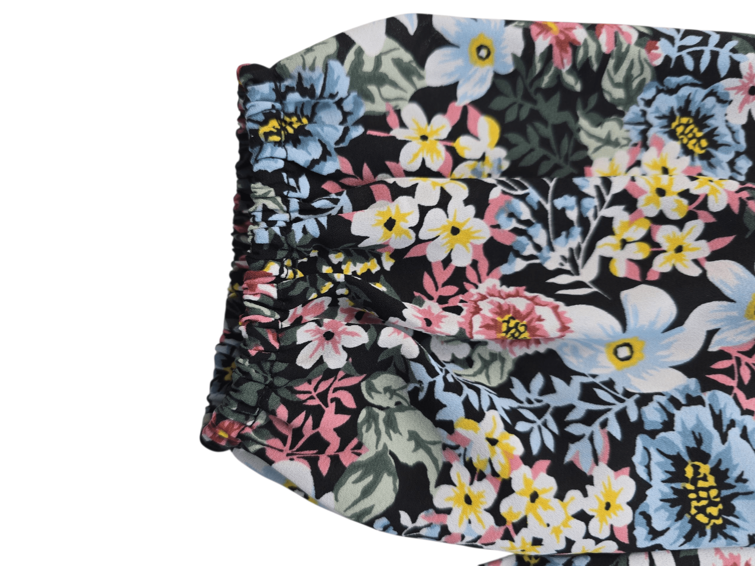 Floral-patterned fabric with black background and colorful flowers.