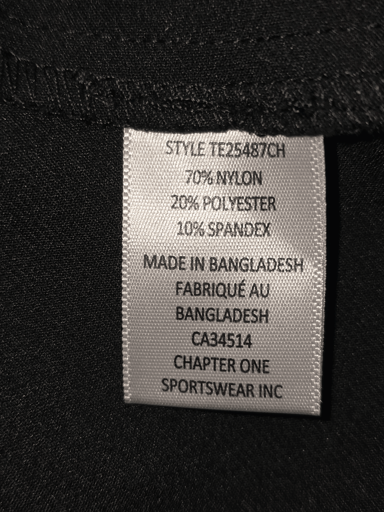 Clothing label showing fabric composition and manufacturing details.