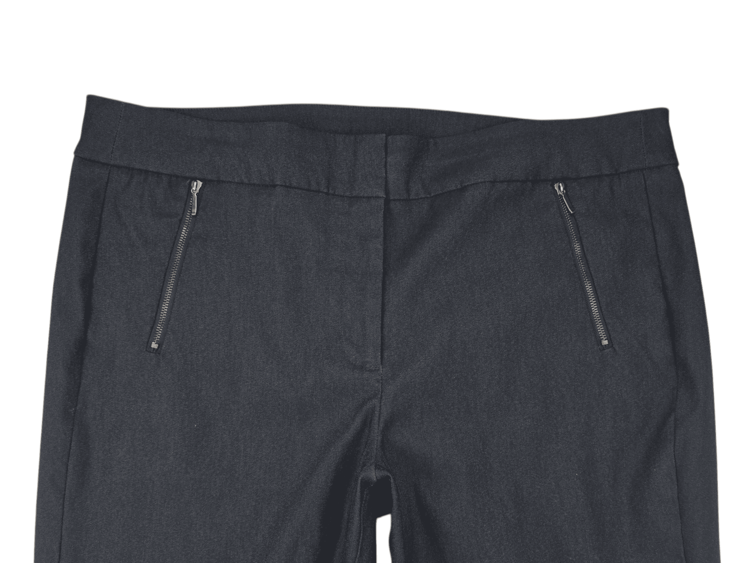 Close-up of black pants with zippered pockets.