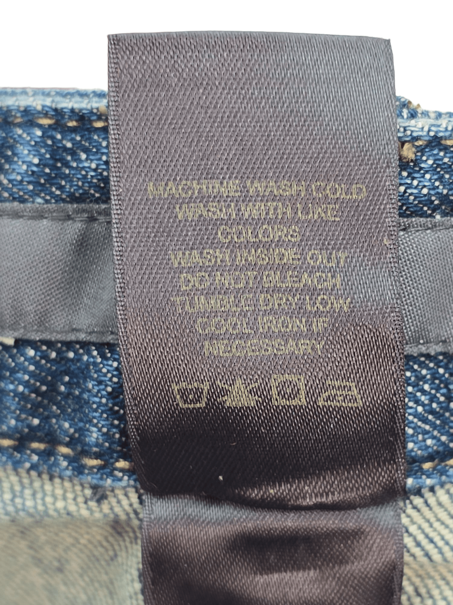 Garment care tag for Liz Claiborne cropped denim pants showing washing and drying directions.