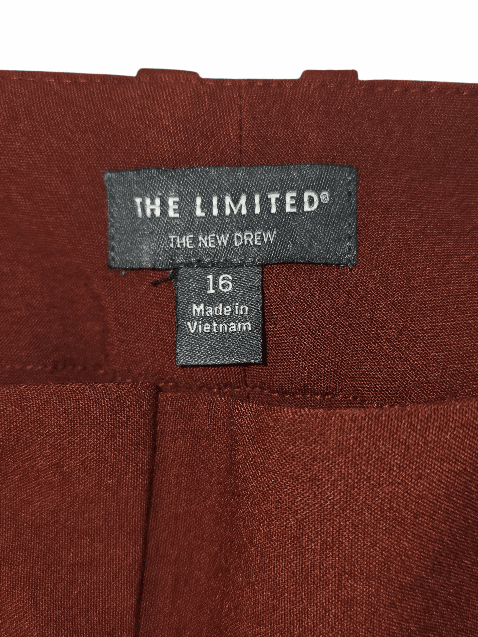 The Limited brand and size tag on “The New Drew” tapered pants wine color women’s size 16