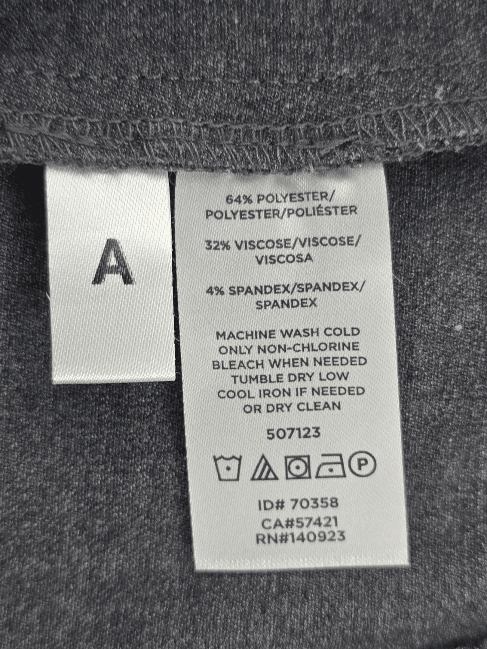 Material content tag listing polyester, rayon, and spandex blend for NWT LOFT Curvy smokey gray straight leg dress trousers.