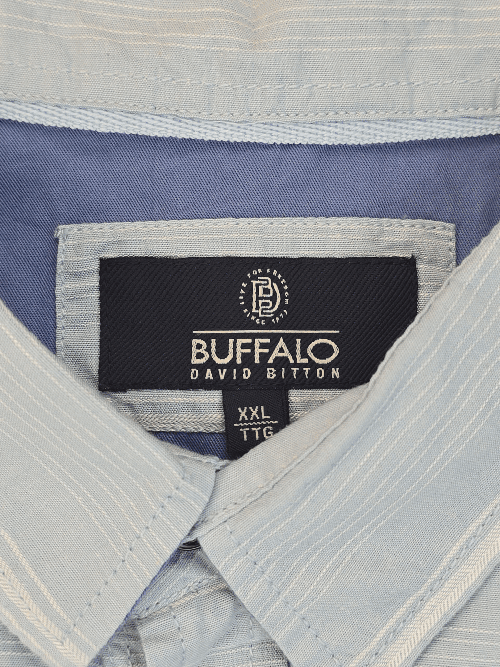 Close-up of a Buffalo David Bitton shirt collar and label.