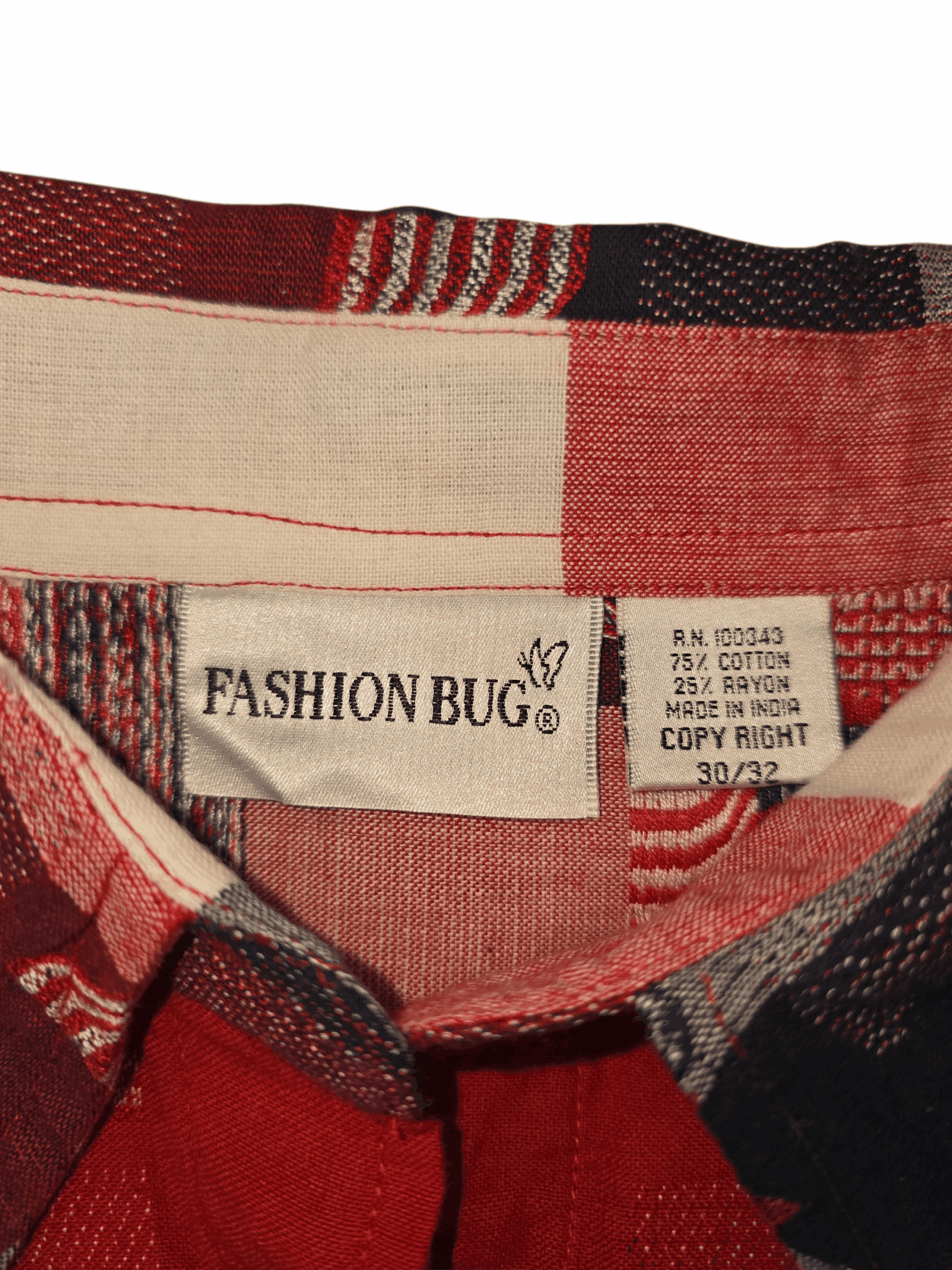Fashion Bug brand and size tag on red, white, and blue American flag plaid button-up shirt in women’s plus size 30/32.