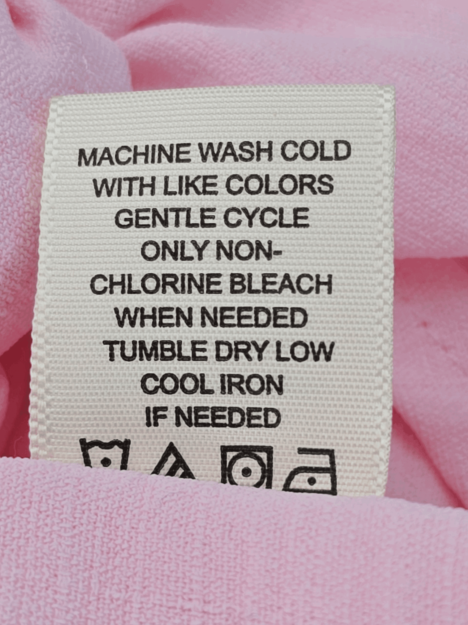 Clothing care label with washing and drying instructions.