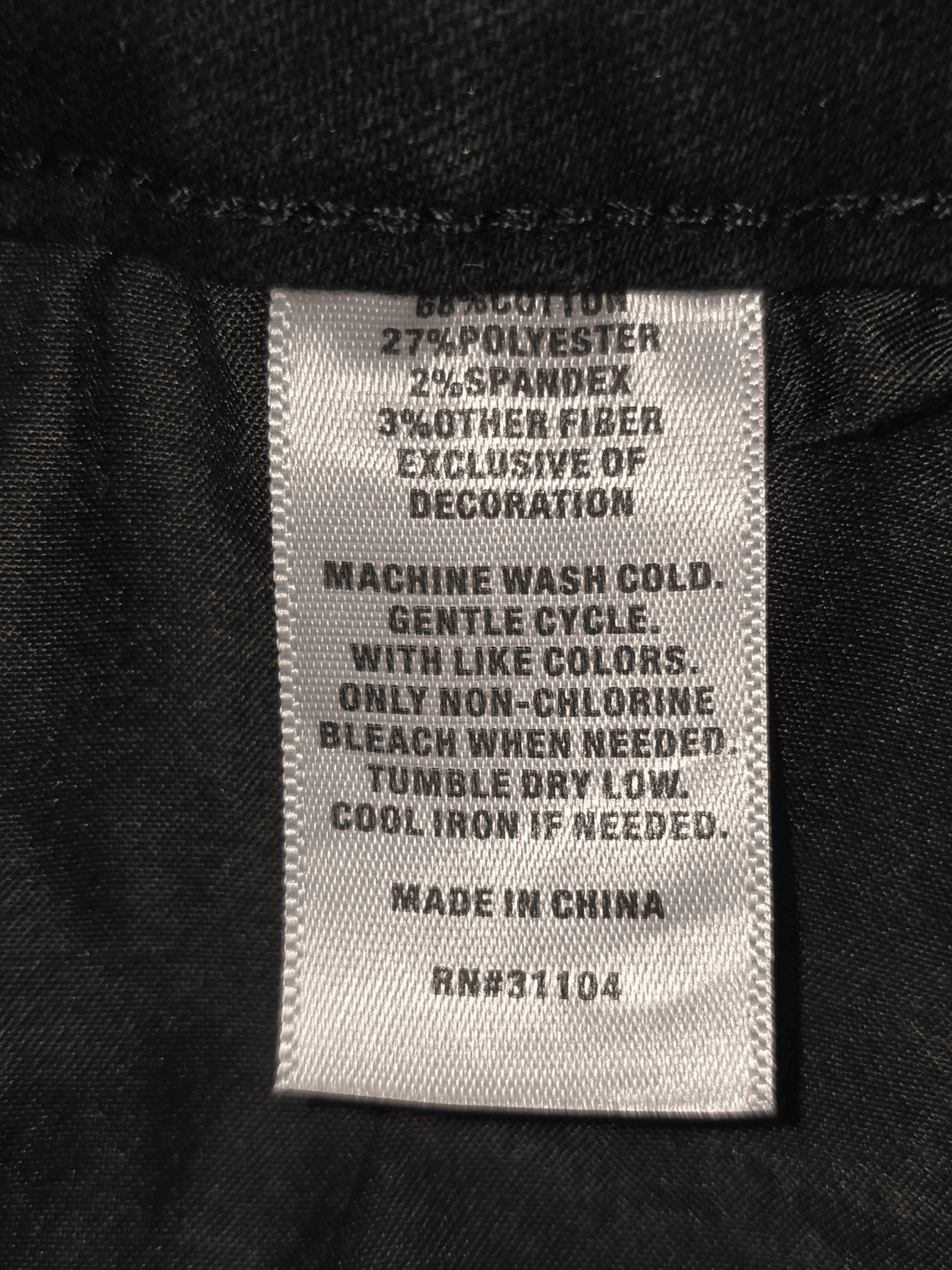 Material content tag listing cotton, polyester, and spandex blend for True Craft high rise skinny black jeans.
