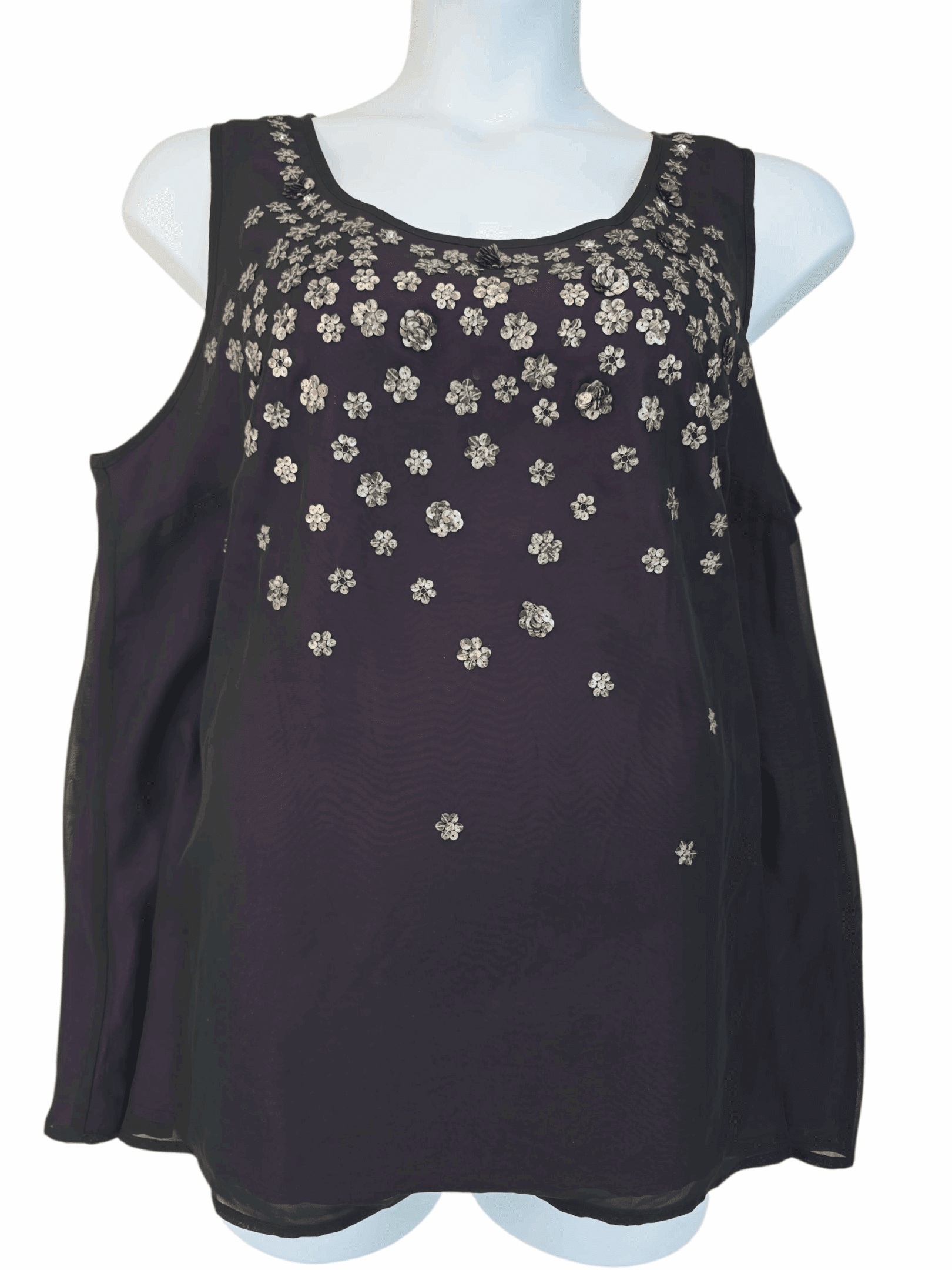 Black sleeveless top with scattered floral embellishments.