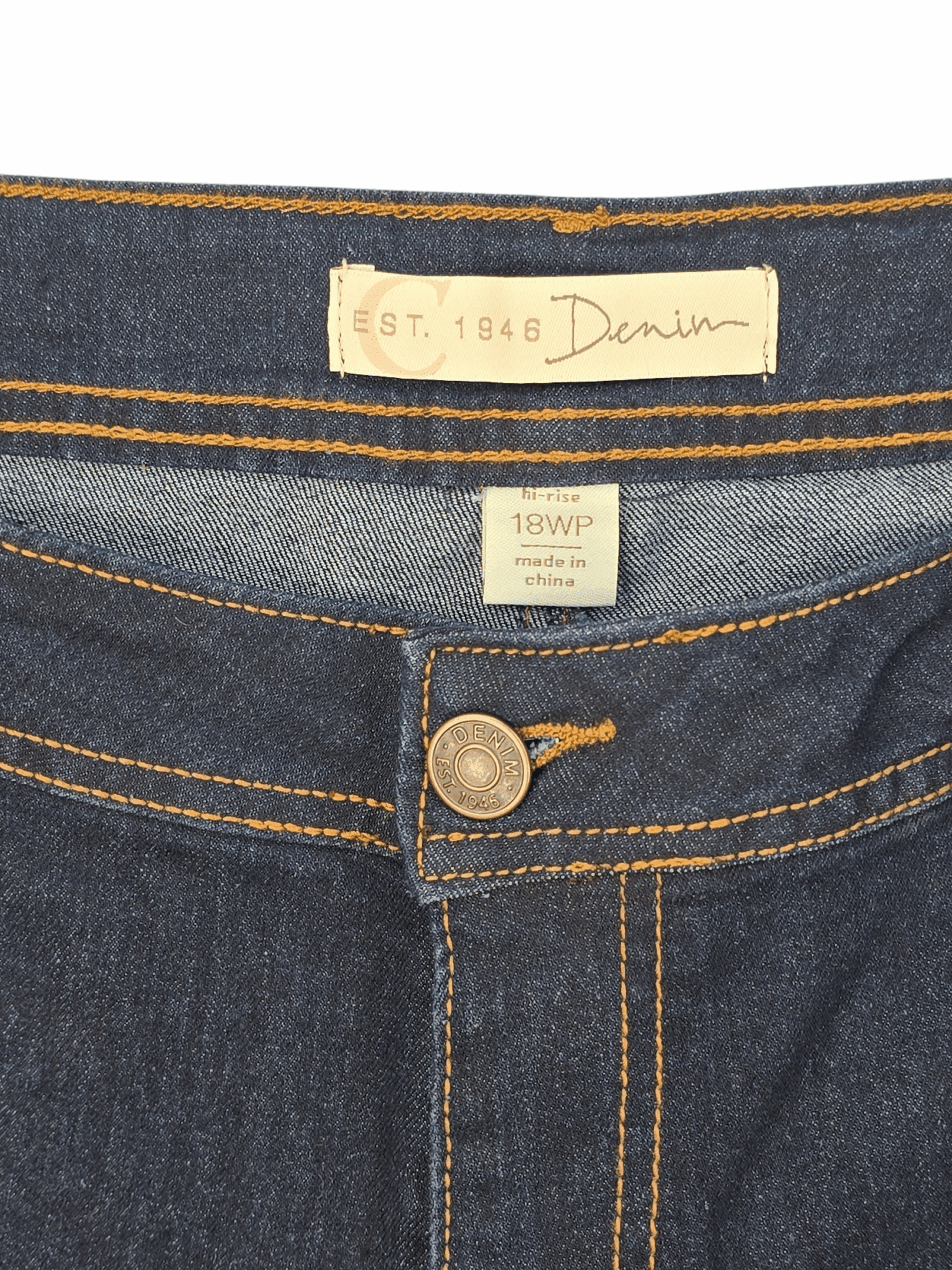 EST. 1946 brand and size tag on denim blue straight-leg jeans in women’s size 18WP.