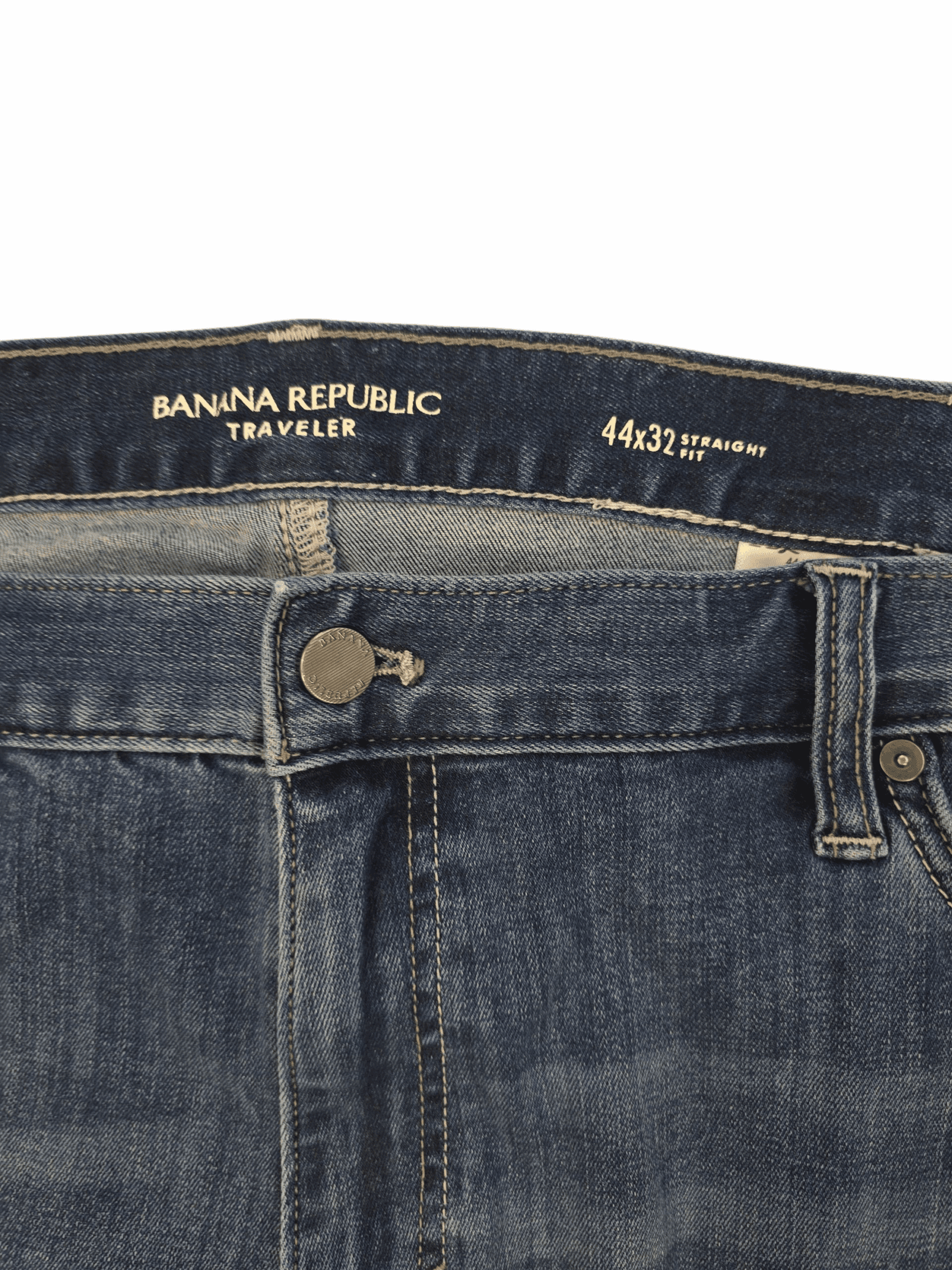 Close-up of Banana Republic brand and 44x32 size tag on blue straight fit jeans