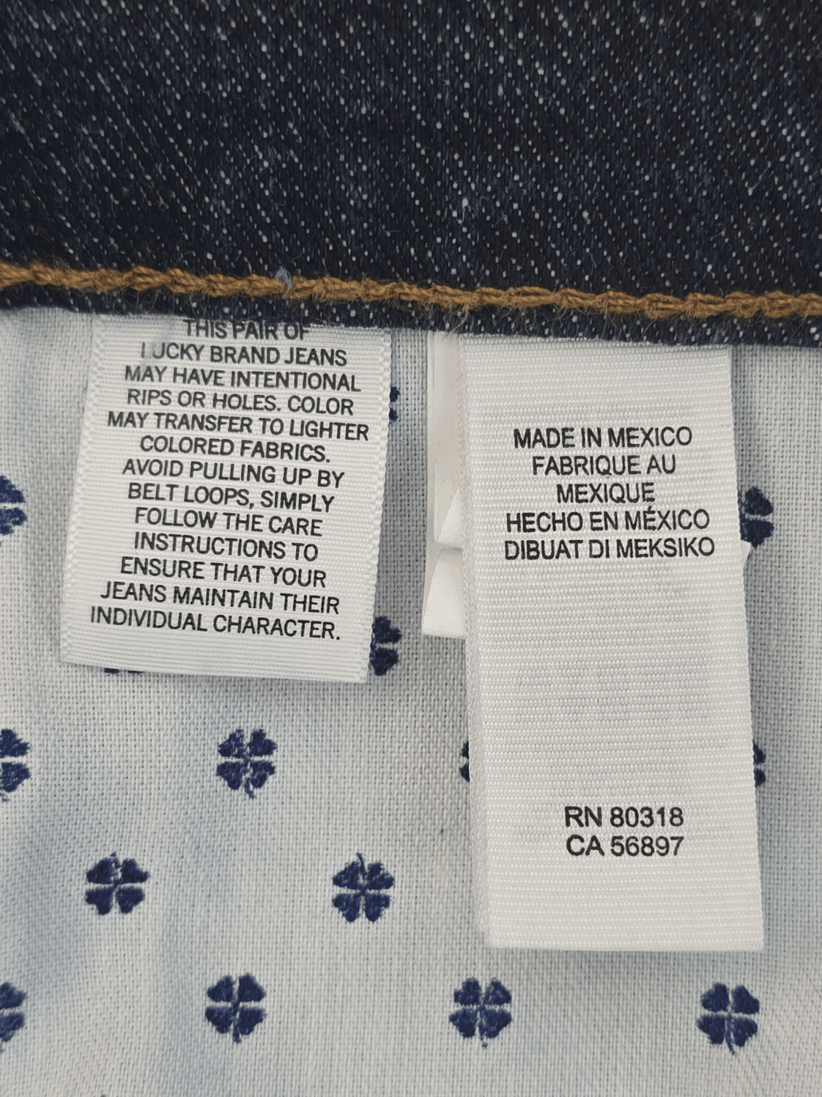Clothing label with washing instructions and manufacturing details.