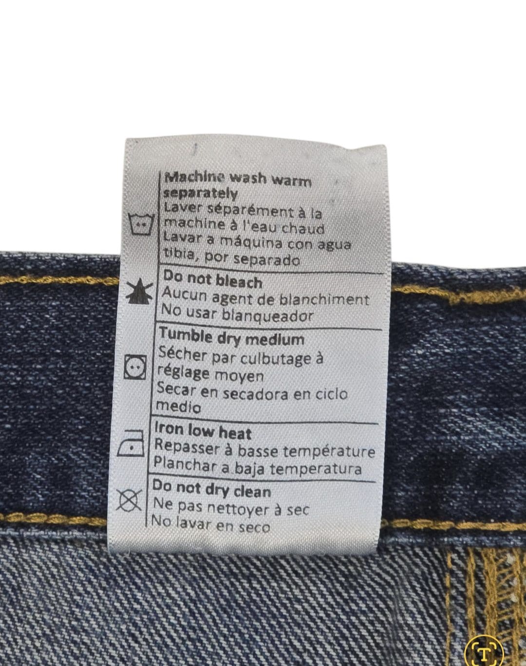 Garment care instruction tag from Carhartt blue straight leg jeans men’s big & tall size 40x34