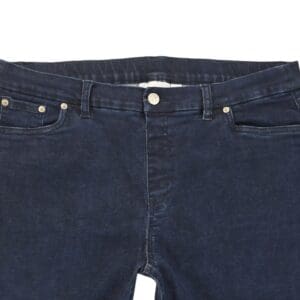 Close-up of D&Co pull-on blue jeans showing waistband, faux fly stitching, and denim texture.