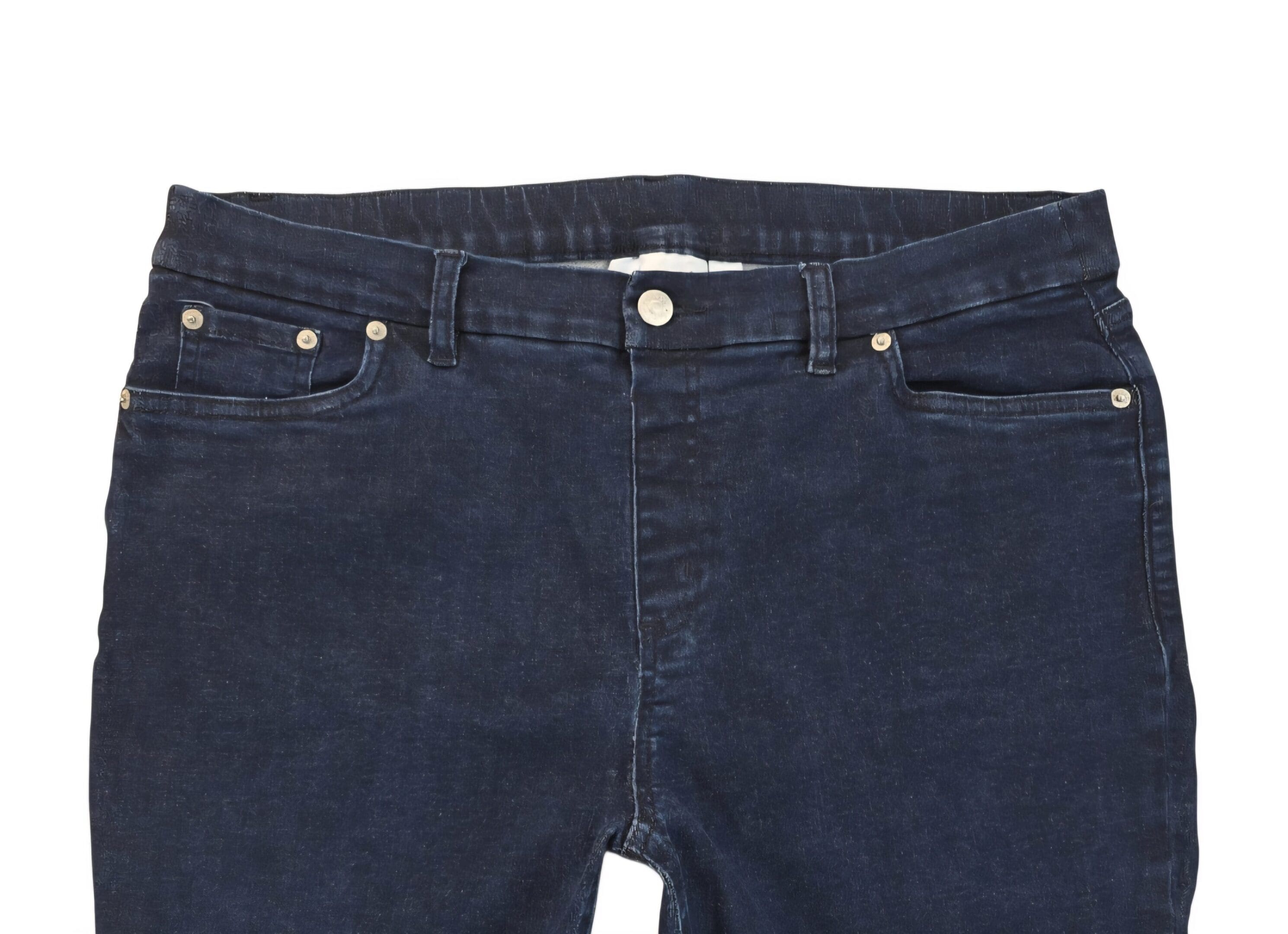 Close-up of D&Co pull-on blue jeans showing waistband, faux fly stitching, and denim texture.