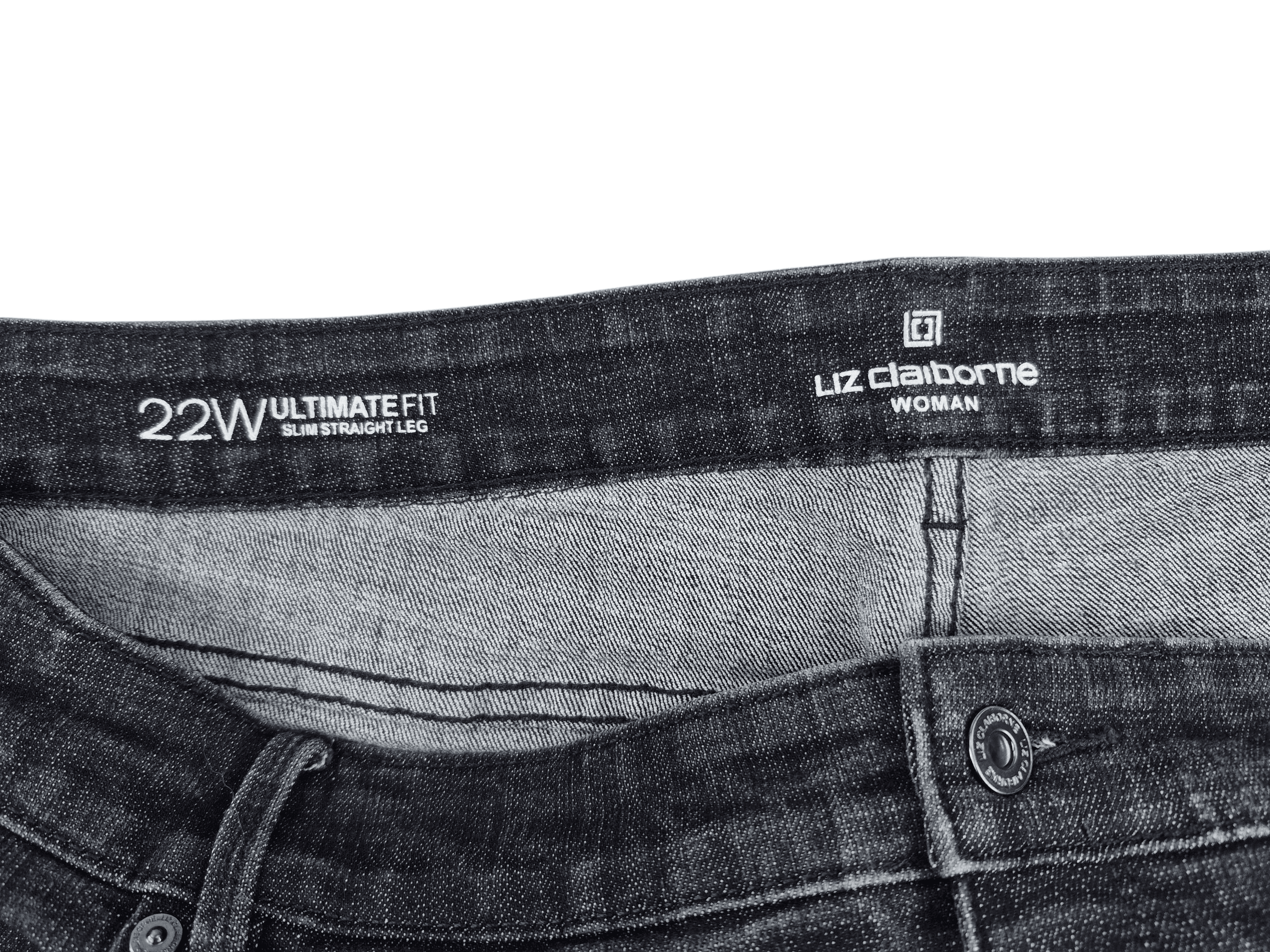 Close-up of Liz Claiborne Woman brand and 22W size tag on Ultimate Fit dark wash jeans