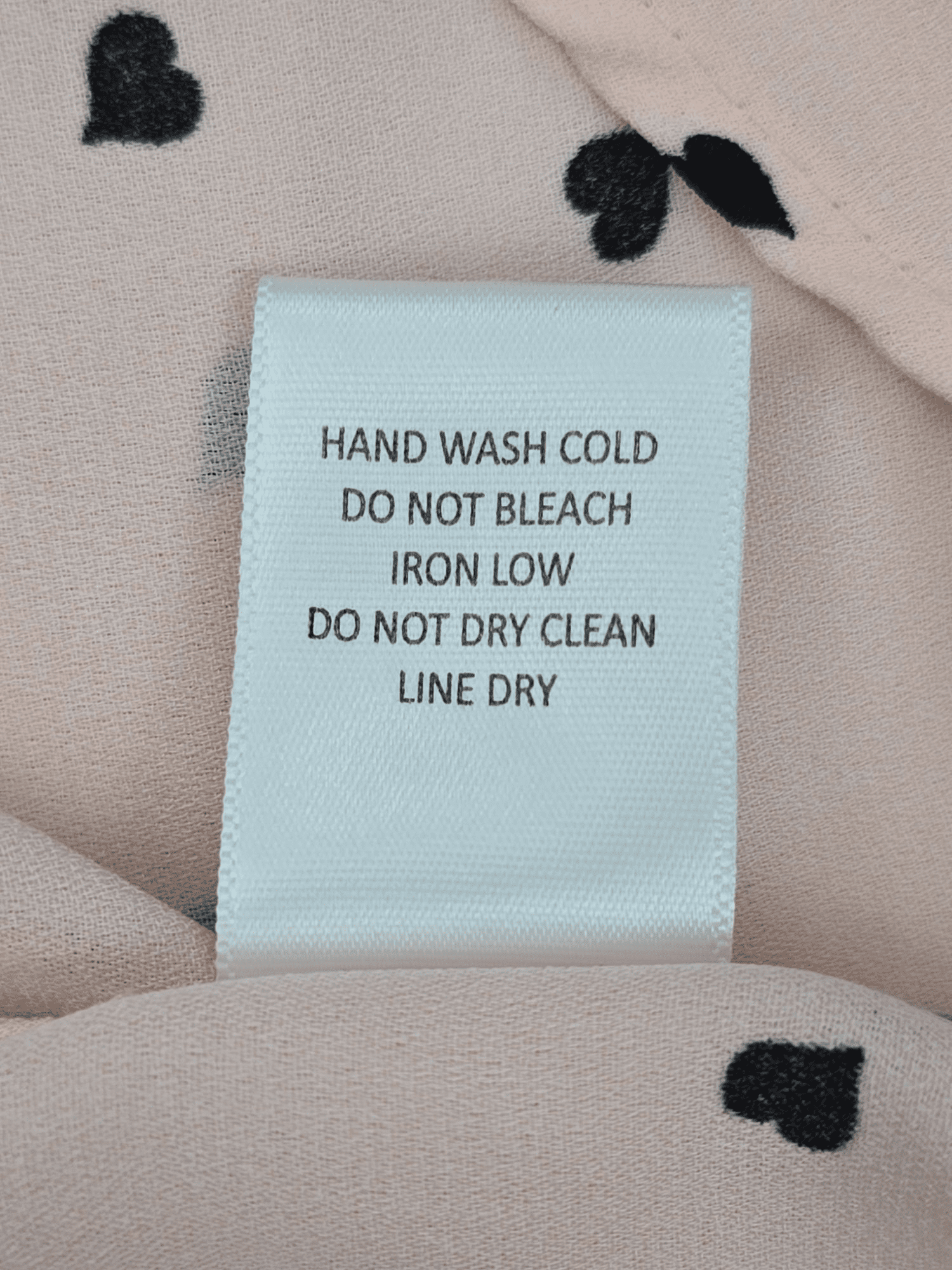 Sweet Rain pink heart print cap sleeve pullover top care instructions tag