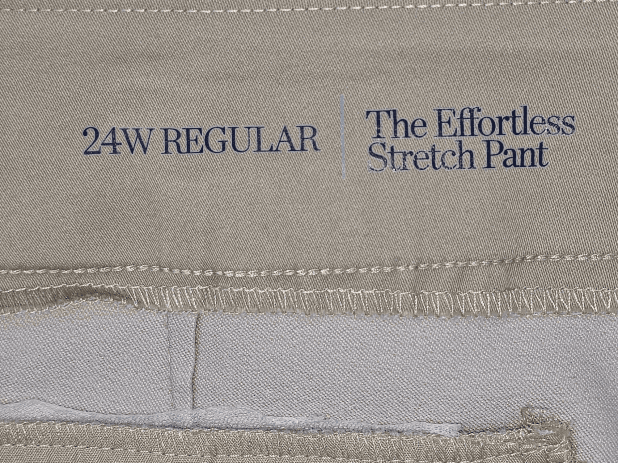 Close-up of Croft & Barrow brand and 24W size tag on khaki pull-on straight-leg pants