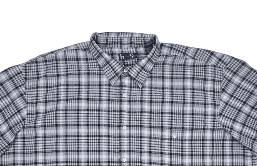 Close-up of front of B-Line men’s size 4XL black and gray checked short-sleeve button-up shirt showing collar, buttons, and pocket