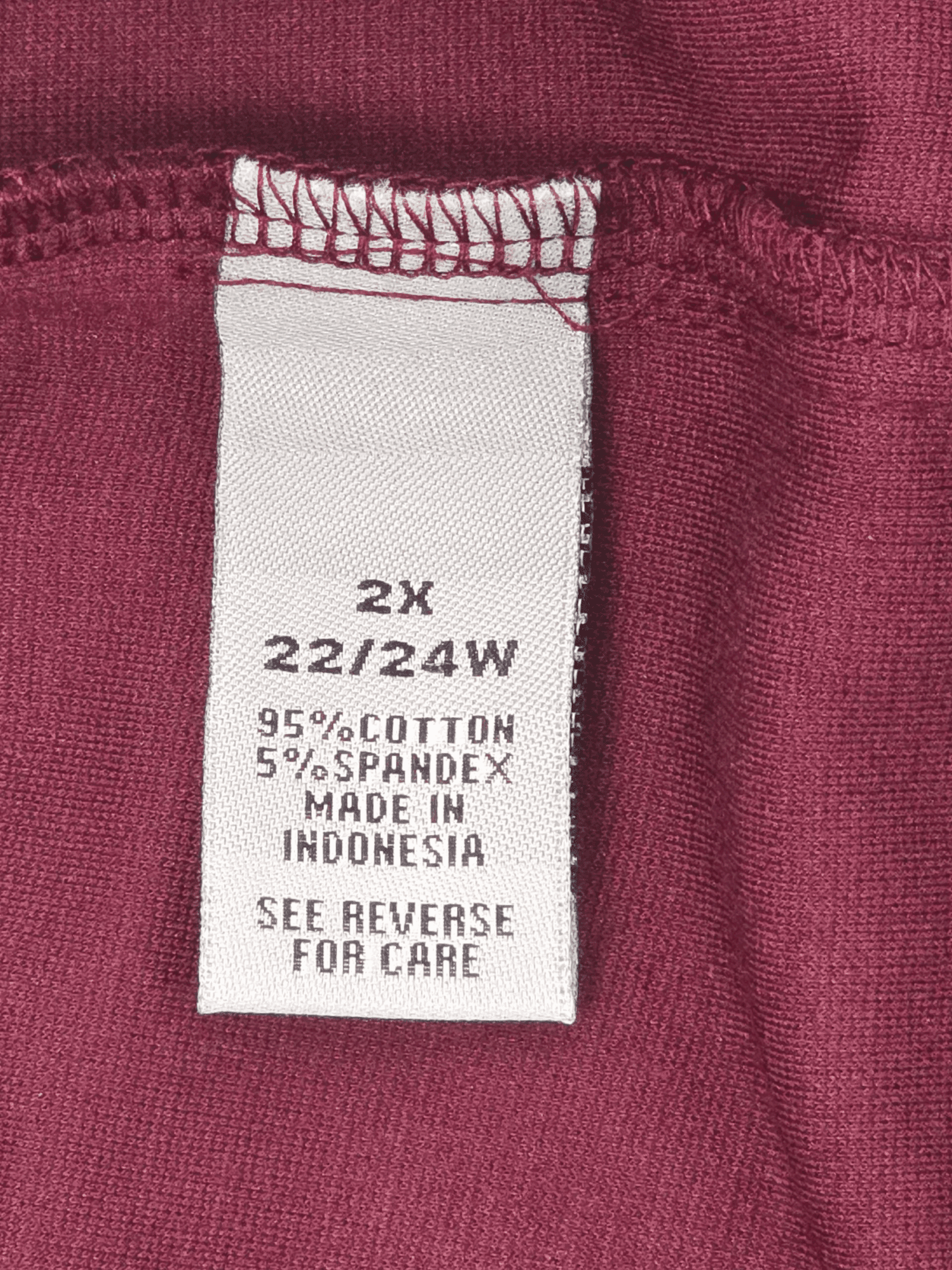 Close-up of material content and garment care tag on Catherine’s Suprema Collection women’s size 2X petite wine pull-on capri pants