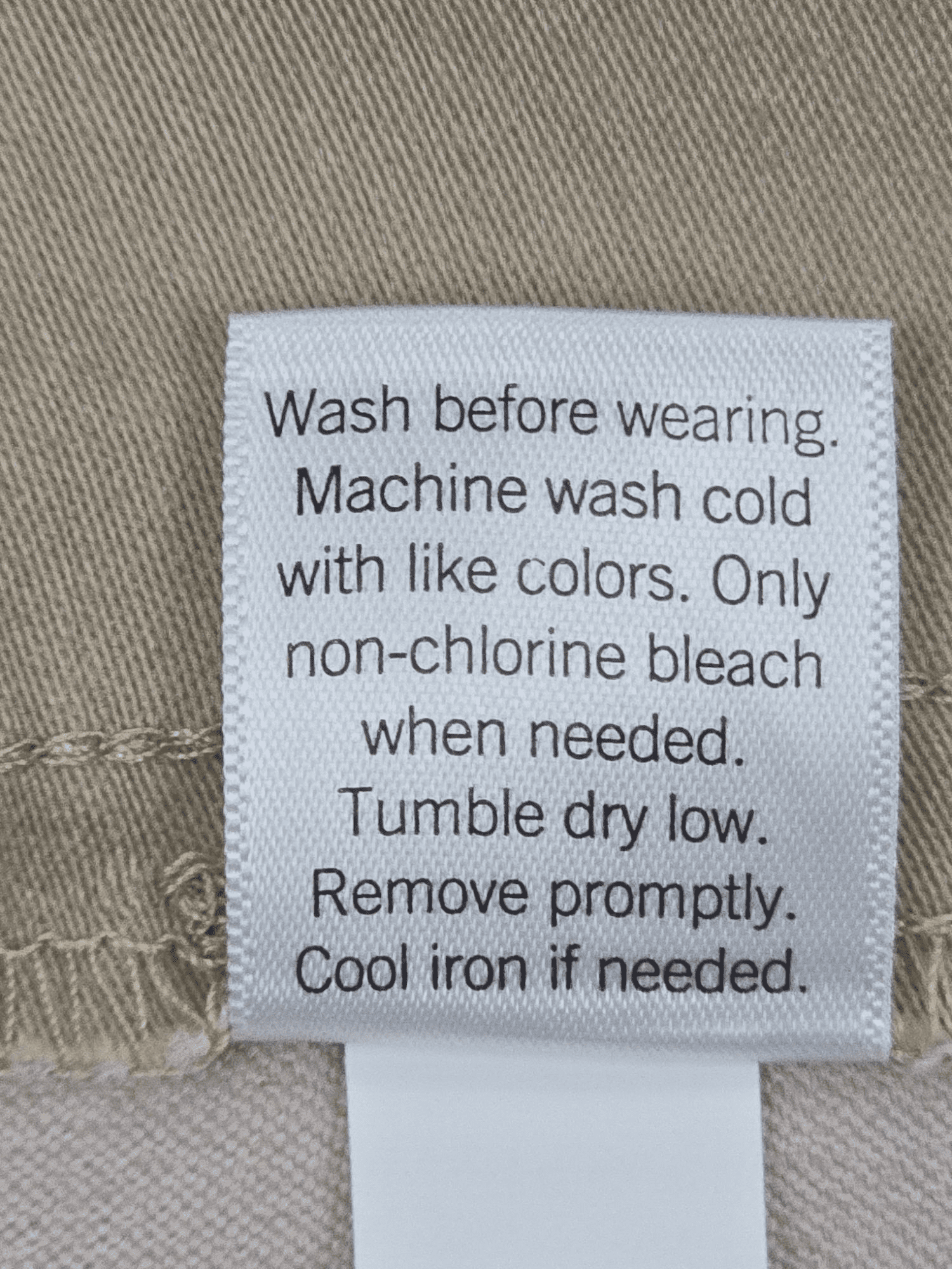 Close-up of material content and garment care tag on Croft & Barrow women’s size 24W khaki pull-on straight-leg pants