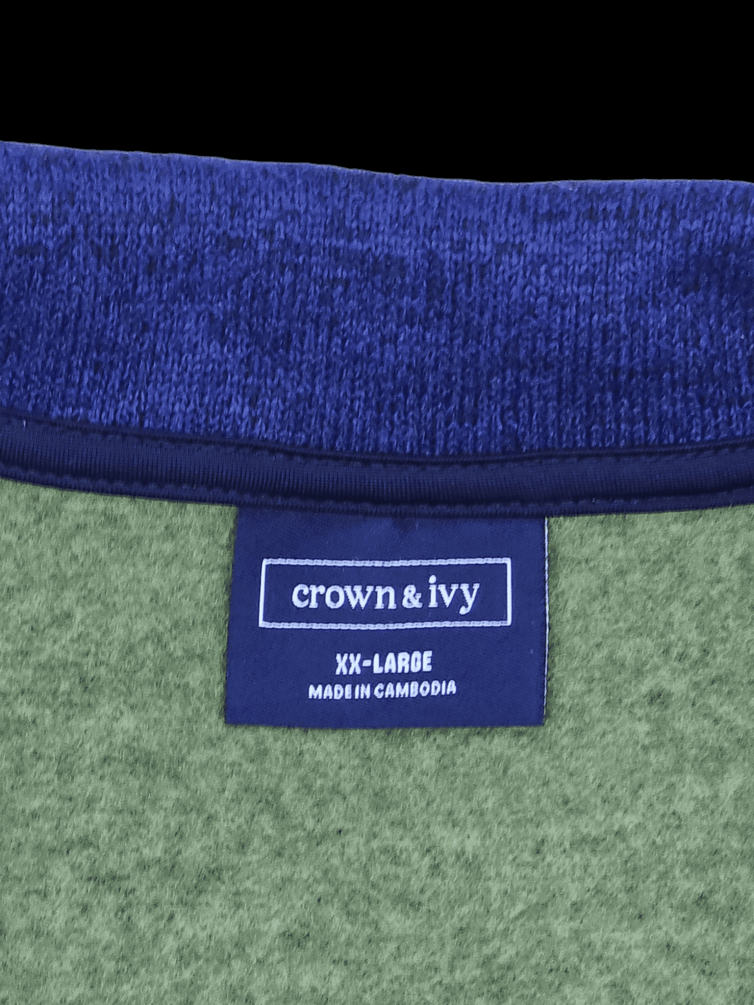 Close-up of front of Crown & Ivy men’s size XXL green full-zip winter vest showing zipper, fabric, and pocket detail