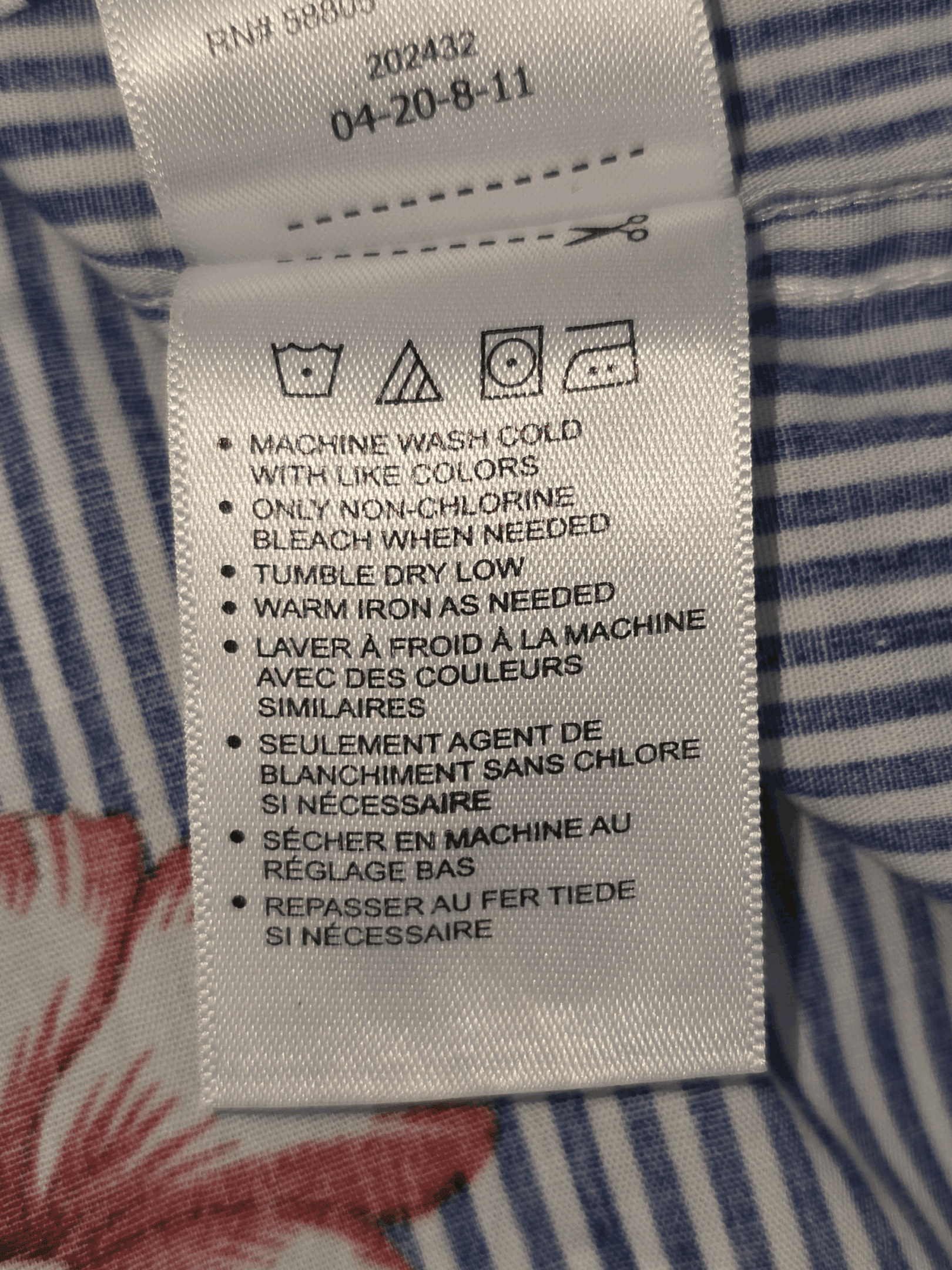 True Nation blue and white hibiscus stripe button-up shirt care instructions tag