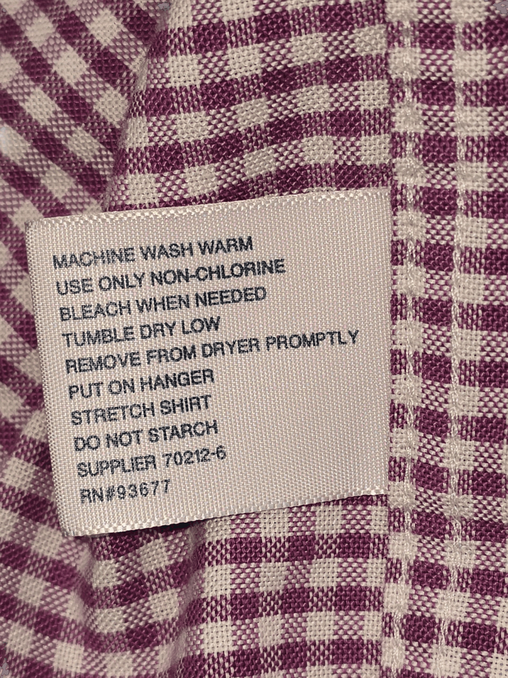 Material content tag showing cotton and polyester blend with washing instructions