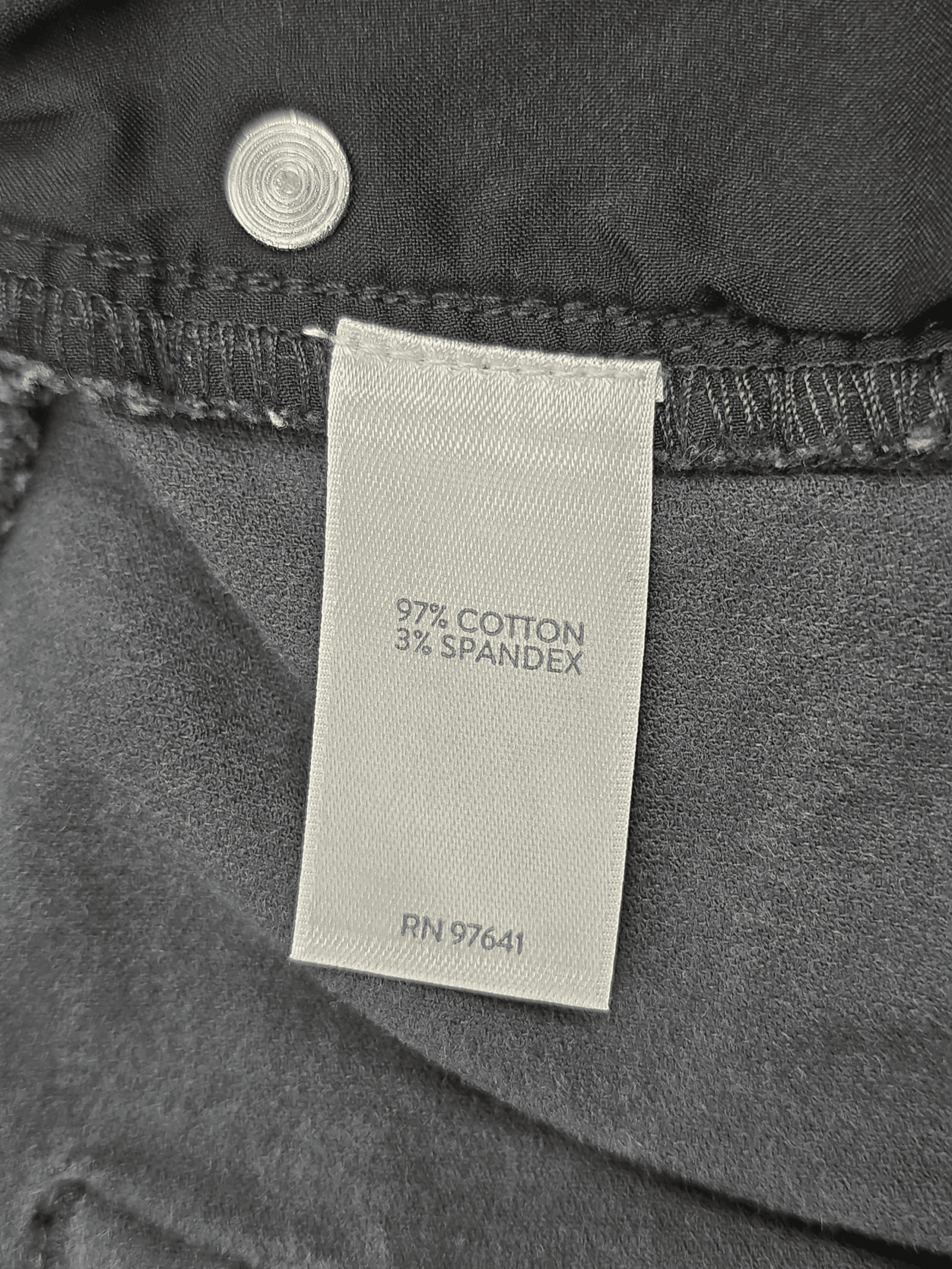 Close-up of material content and garment care tag on J. Jill women’s size XLT smoky gray corduroy straight-leg pants