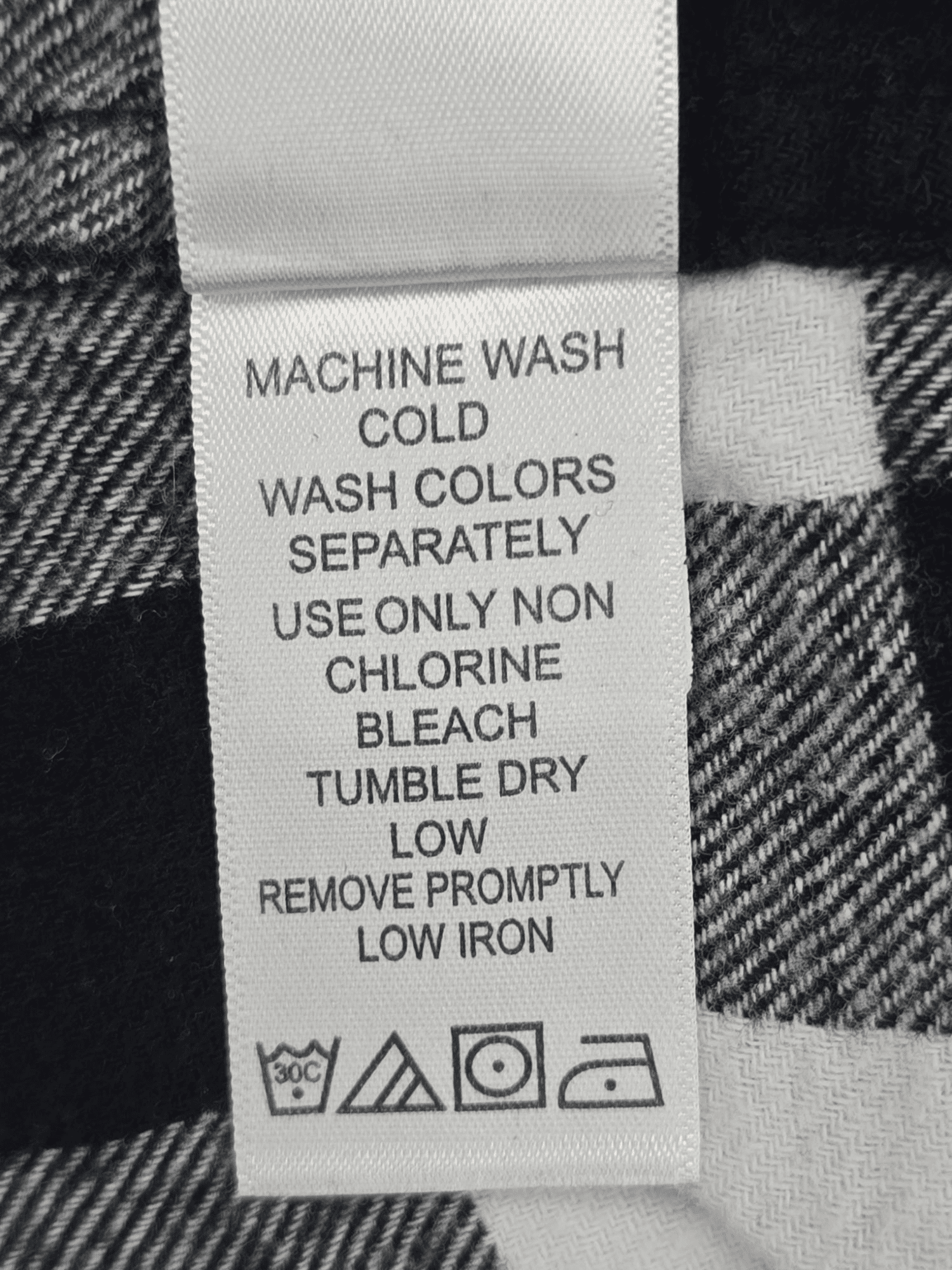 Ellos black and white plaid flannel button-up shirt care instructions tag