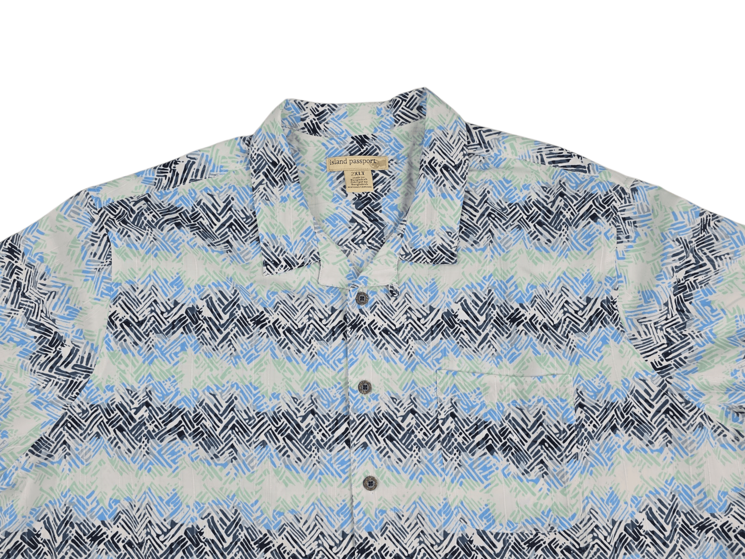 Close-up of front of Island Passport men’s size 2XLT multicolor abstract button-up shirt showing buttons and fabric pattern